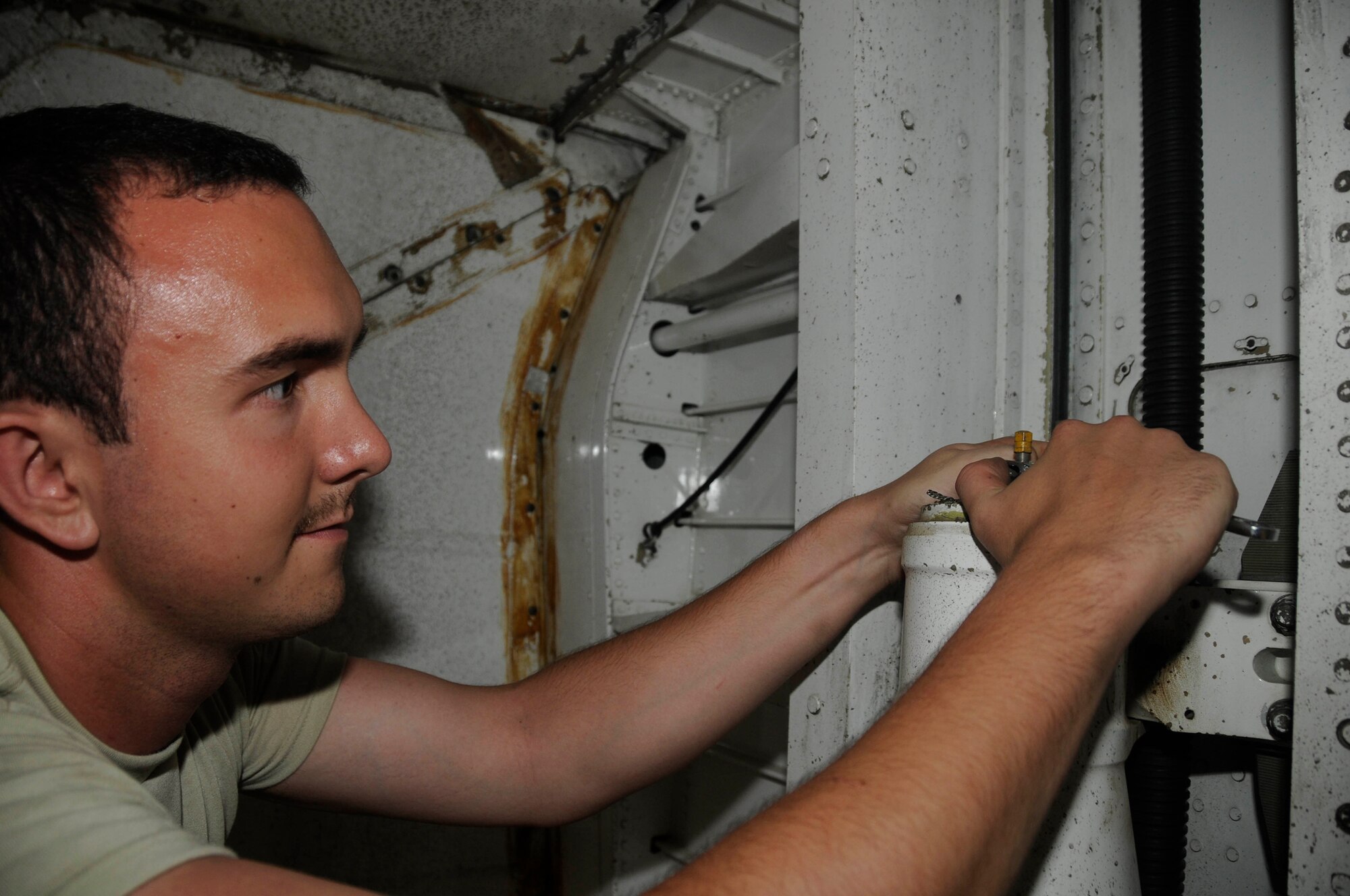 Senior Air Craftsman Ben Wyatt, aircraft maintenance mechanic assigned to the 2430 Squadron, uses a wrench to perform maintenance on the undercarriage of a VC-10 Sept. 26, 2008, at an undisclosed air base in Southwest Asia. The VC-10 is a dual-role air transport and air-to-air refueling aircraft capable of dispensing to two receiver aircraft simultaneously from two underwing probe-and-drogue pods. VC-10s assigned here refuel British and other coalition aircraft supporting Operations Iraqi and Enduring Freedom.  Craftsman Wyatt, a native of Portsmouth, England, is deployed from Royal Air Force Lyneham, England. (U.S. Air Force photo by Staff Sgt. Darnell T. Cannady/Released)
