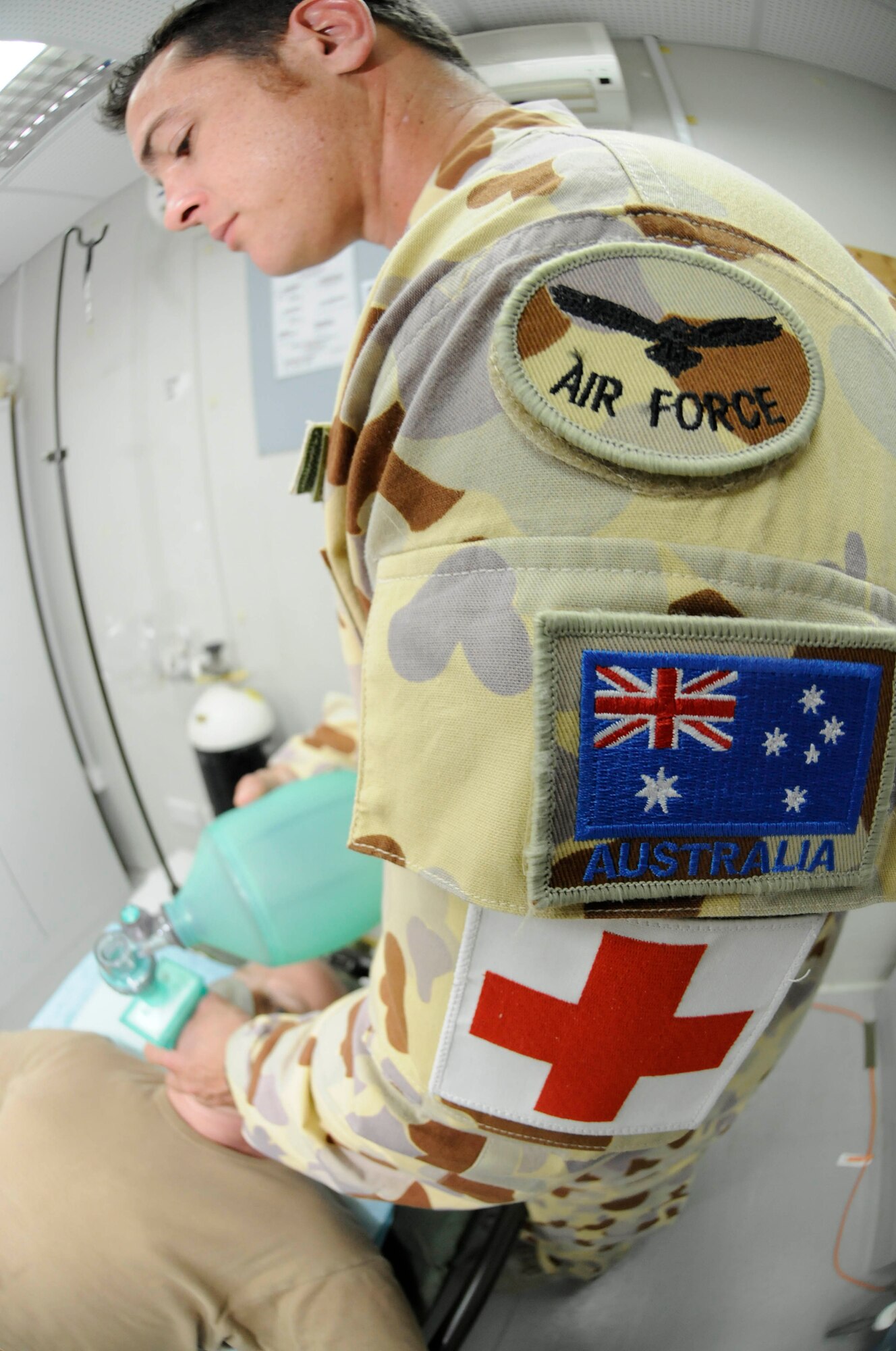 Leading Air Craftsman Brendan Williams, medical assistant assigned to the Expeditionary Health Facility Task Group 633.4, practices using a bag valve mask on Squadron Leader Toby Leslie, officer in charge assigned to the Expeditionary Health Facility Task Group 633.4, Sept. 26, 2008, at an undisclosed air base in Southwest Asia. The EHF members are responsible for providing primary medical and aviation medical support to all Australian coalition forces here. Craftsman Williams, a native of Newcastle, Australia, is deployed from Royal Australian Air Force Base Williamtown, and Leader Leslie, a native of Yeppoon, Queensland, Australia, is deployed from RAAFB Amberley.  Both are supporting Operations Iraqi Freedom, Enduring Freedom and Joint Task Force-Horn of Africa. (U.S. Air Force photo by Staff Sgt. Darnell T. Cannady/Released)