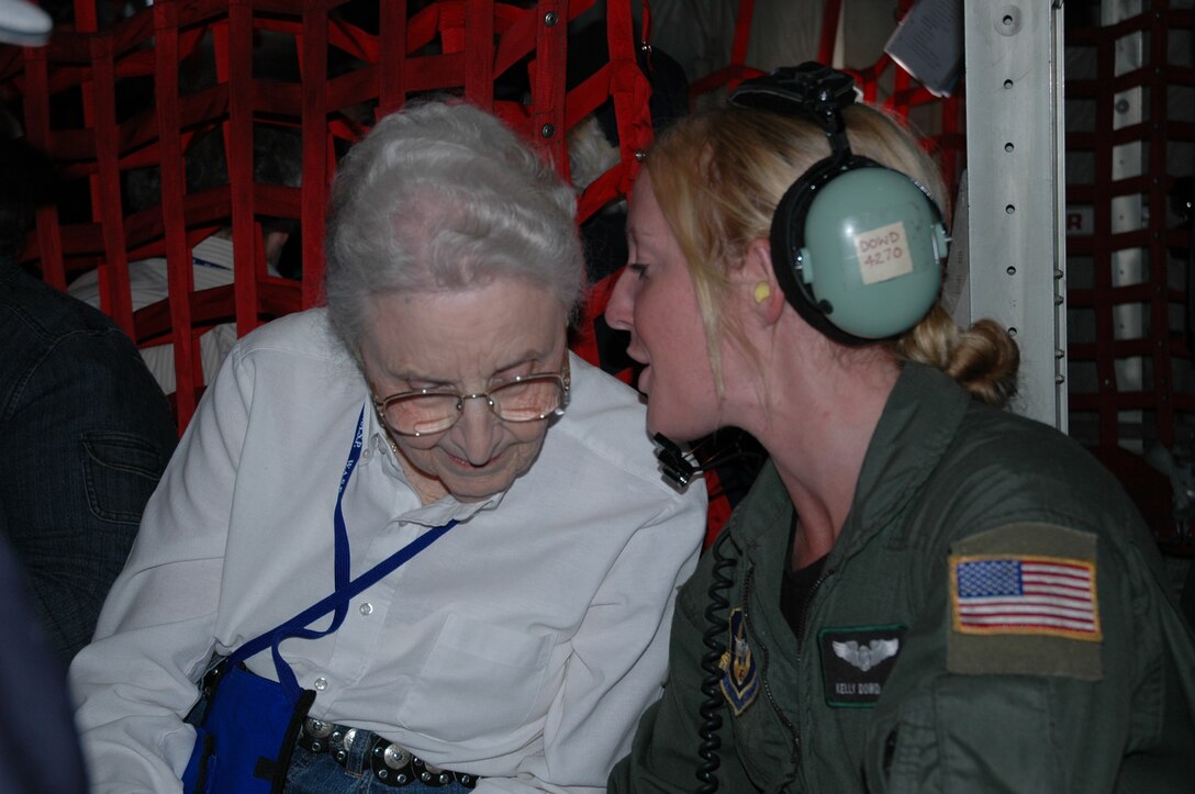 Women Airforce Service Pilot Pearl Brummett Judd shares experiences with Senior Airman Kelly Dowd aboard a C-130 during a WASP farewell reunion flight near Love Field, Texas.  Dowd was the loadmaster on the all-female crew from the 302nd Airlift Wing, Peterson Air Force Base, Colo., who flew to Dallas to honor the contributions of the first U.S. women military pilots. U.S. Air Force photo/ Tech. Sgt. 
Daniel Butterfield 