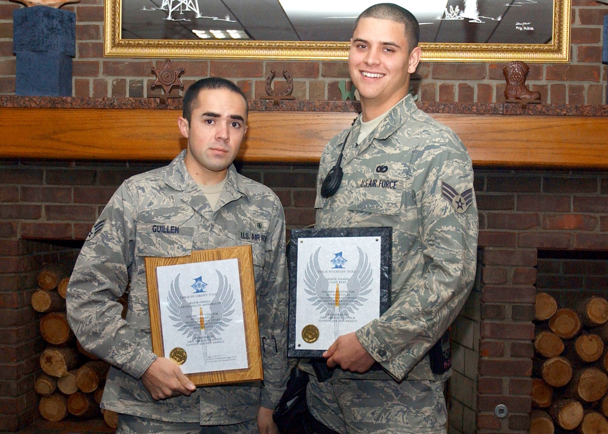 CANNON AIR FORCE BASE, N.M. -- Diamond Sharp Winners Senior Airman Carlos Guillen, 27th Special Operations Aerospace Medicine Squadron, and Senior Airman Chase Ryan, 27th Special Operations Security Forces Squadron, stand with their awards at the Pecos Trail Dining Facility on Sept. 26. Senior Airman Harlyn Johnson, 27th Special Operations Equipment Maintenance Squadron, was also a Diamond Sharp winner, but was unable to attend the ceremony. Diamond Sharp awards  recognize Airmen for the examples they set for others. (U.S. Air Force photo by Elizabeth Merchant)


