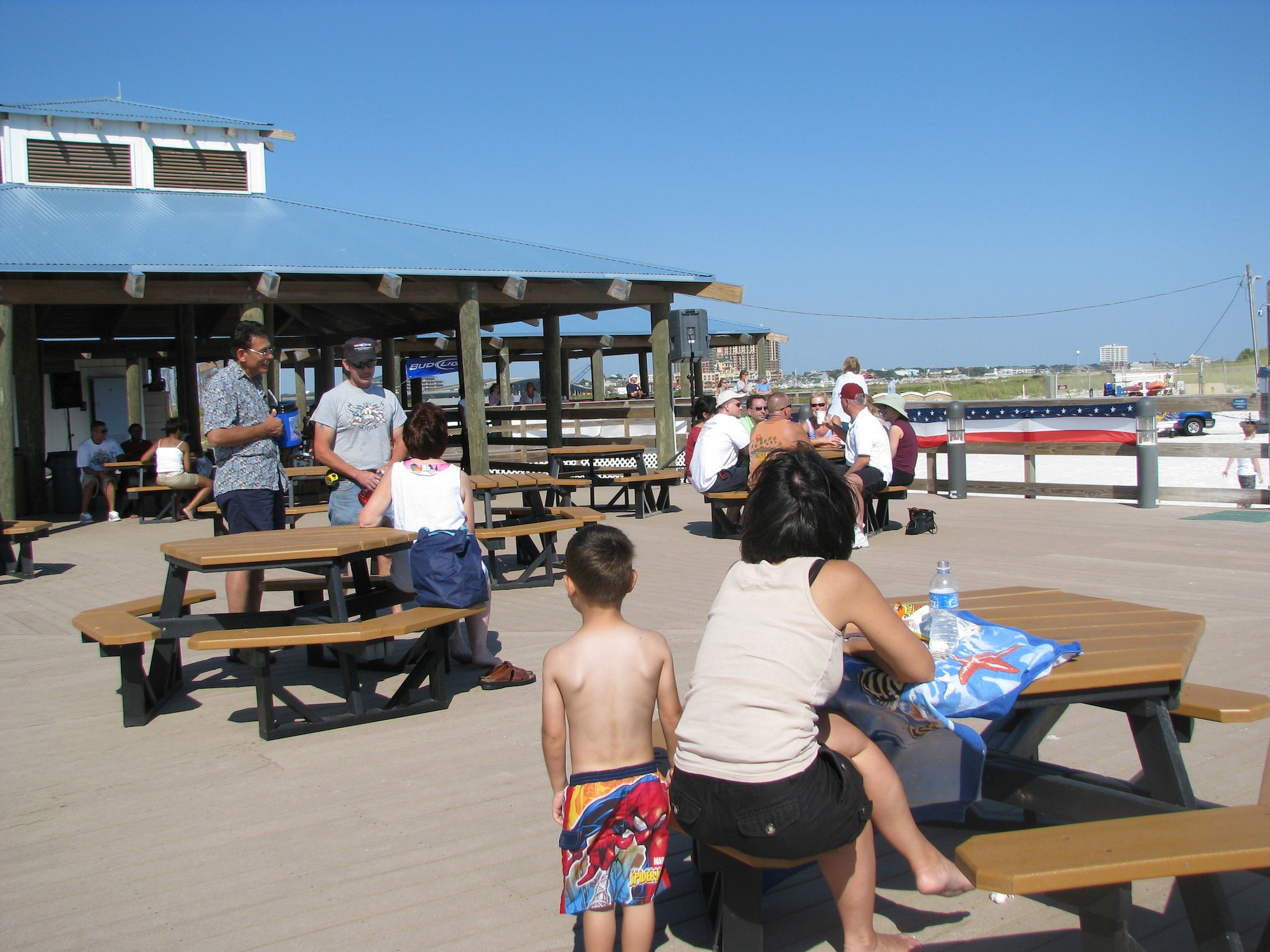Airmen and Eglin personnel enjoy the sun on the pavillion during Beach Bash hosted at Beach Park on Okaloosa Island Sept. 26. The event was an afternoon of fun designed to promote team building, unit morale and celebrate the end of 101 days of a safe summer.(U.S. Air Force photo by Staff Sgt. LuCelia Ball)