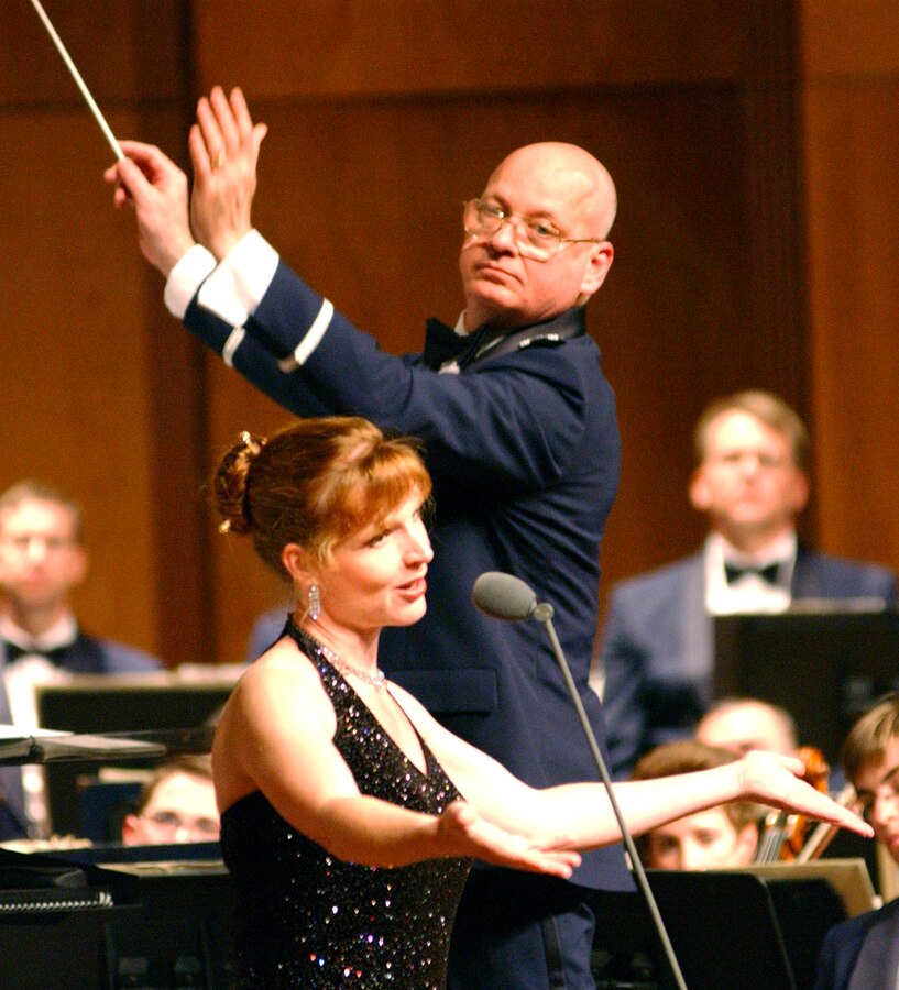 Master Sgt. Anne Seaton thrills the audience in a solo performance with The United States Air Force Band from Washington, DC. A soprano vocalist with the USAF Singing Sergeants, Sgt. Seaton has helped entertain thousands of Americans while touring the nation twice annually with the Concert Band and Singing Sergeants.