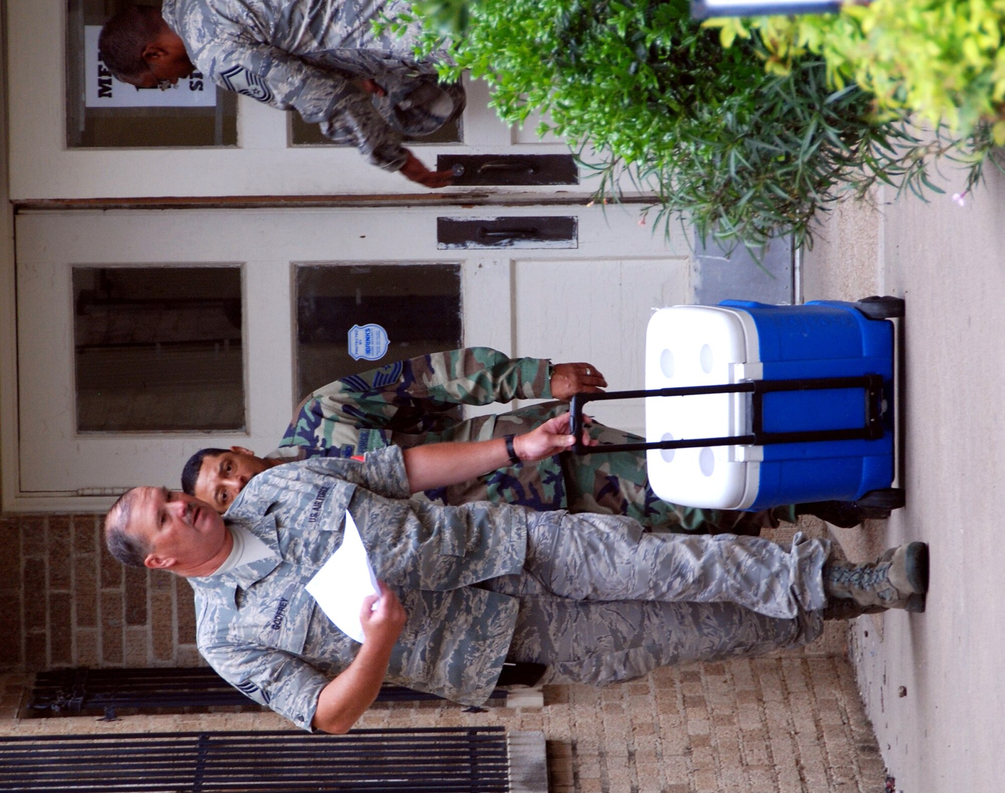 Chief Master Sgt. Mark Godfrey, 301st Aircraft Maintenance Squadron, and other 301st Fighter Wing members start their day's deliveries for Meals on Wheels. Chief Godfrey, along with other senior enlisted 301st Fighter Wing members, have been involved in the program for nearly two years. (U.S. Air Force Photo)