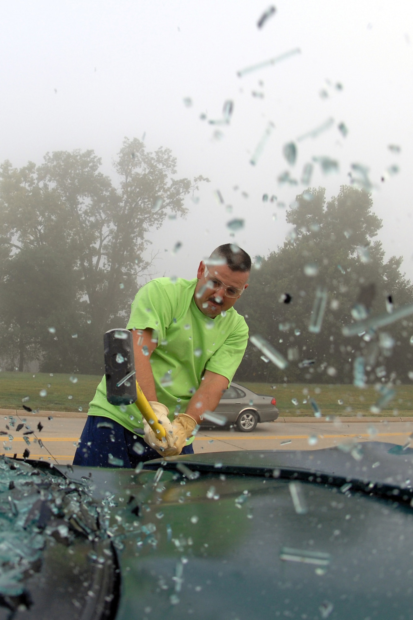 OFFUTT AIR FORCE BASE, Neb. – Tech. Sgt. Chad Been, with the 55th Maintenance Squadron's Petroleum, Oil and Lubricant section, takes a sledge hammer to the trunk lid of a car Sept. 24. The car was donated to Offutt’s Airmen against Drunk Driving organization for use in a fund raiser that was part of this year’s Wingman Days celebration. (U.S. Air Force Photo By Josh Plueger)

