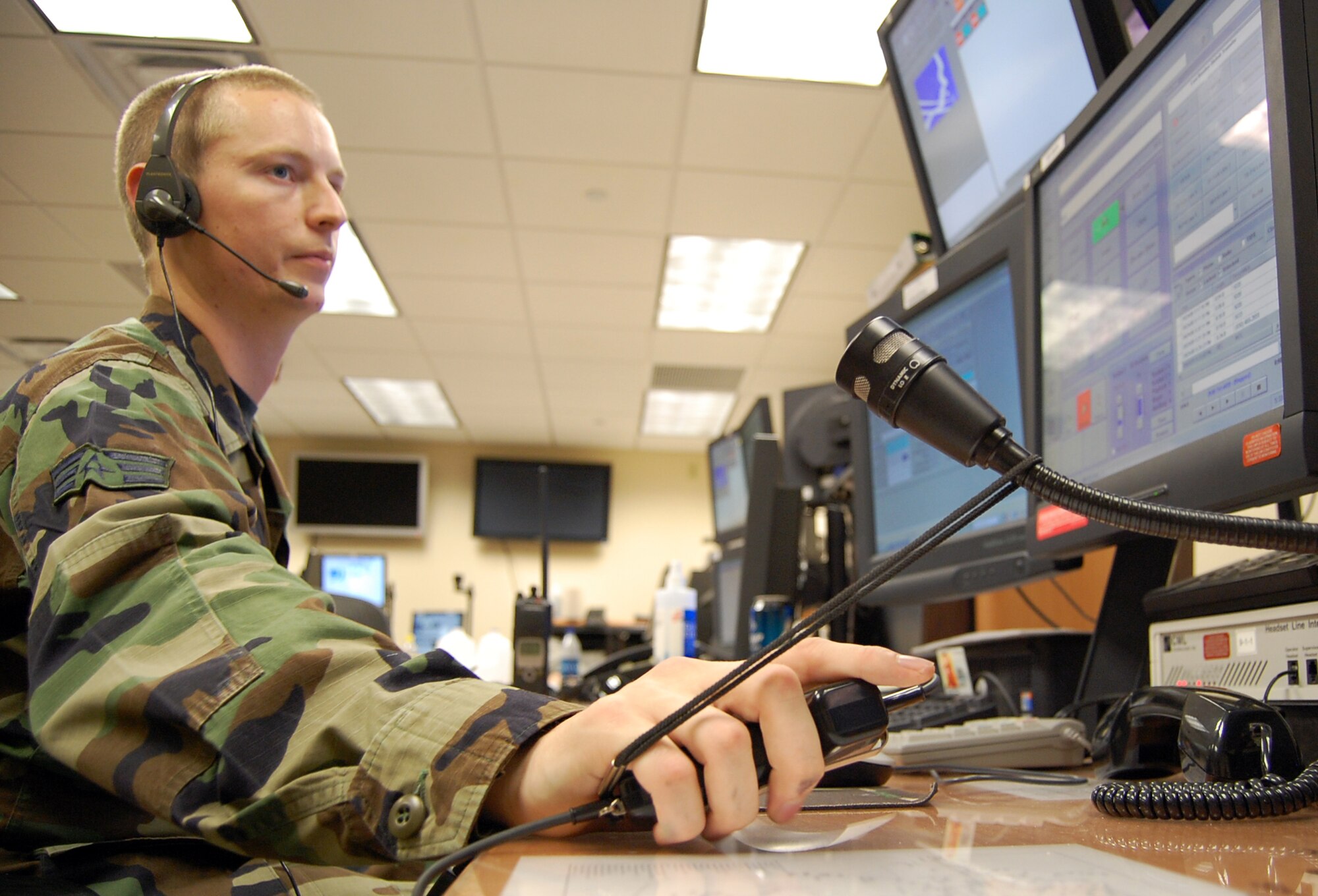 LAUGHLIN AIR FORCE BASE, Texas – Senior Airman Steven Featherston, 47th Installation Support Squadron, monitors emergency communications in the 47th Flying Training Wing Command Post’s Alarm Room here Sept. 24.  During exercises, agencies at every corner of the base participate in order to train as realistically as possible.  (U.S. Air Force photo by Staff Sgt Austin M. May)
