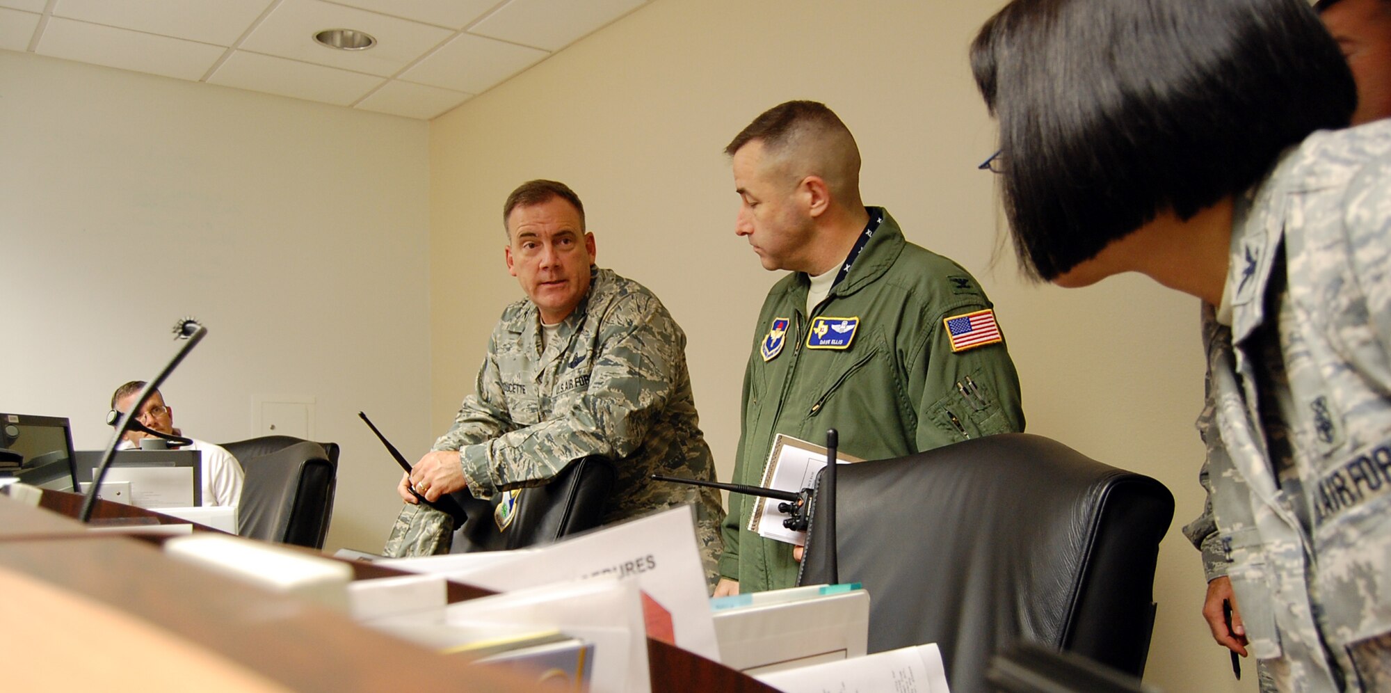LAUGHLIN AIR FORCE BASE, Texas – Col. John Doucette, 47th Flying Training Wing commander, consults with other commanders from within the wing in the Emergency Operations Center here Sept. 24.  Laughlin’s state-of-the-art EOC acts as a central command location for any large-scale event taking place on base in which quick, clear communication among a variety of key agencies is essential.  (U.S. Air Force photo by Staff Sgt Austin M. May)