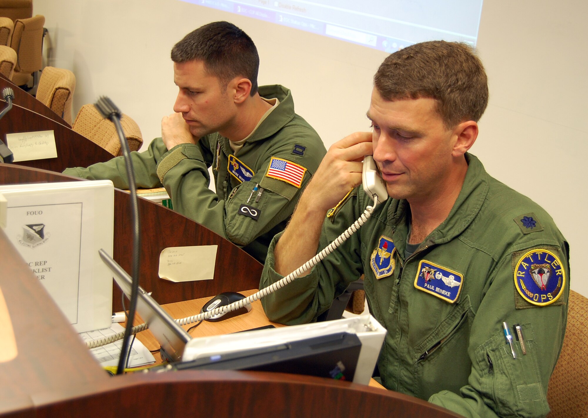 LAUGHLIN AIR FORCE BASE, Texas – Capt. Mark Whisler and Lt. Col. Paul Beineke coordinate movements during an exercise from the 47th Flying Training Wing Emergency Operations Center here Sept. 24.  Laughlin’s state-of-the-art EOC acts as a central command location for any large-scale event taking place on base in which quick, clear communication among a variety of key agencies is essential.  (U.S. Air Force photo by Staff Sgt Austin M. May)