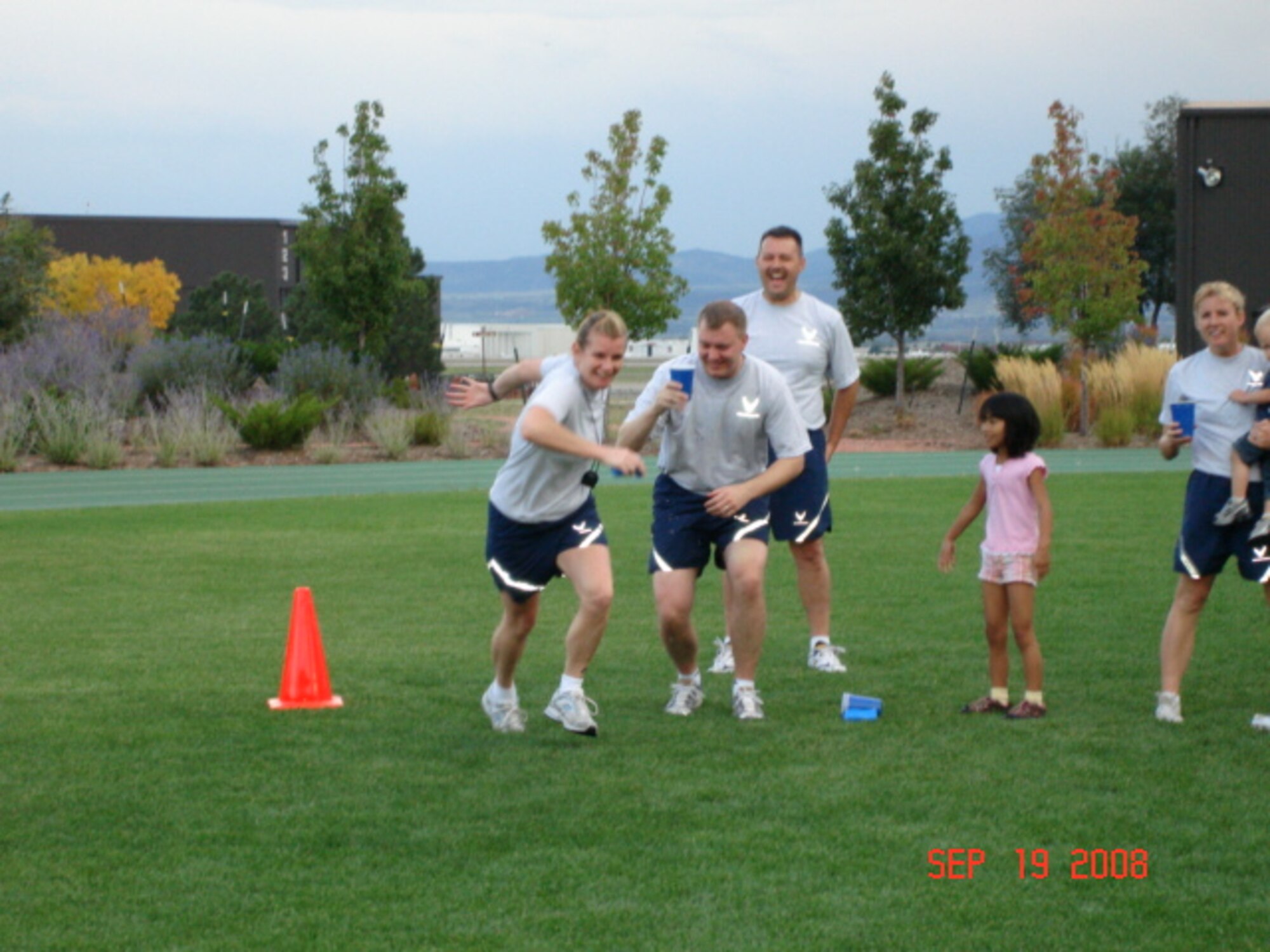 The 21st Aerospace Medicine Squadron has taken a new spin on unit physical fitness.  At 5:30 p.m., Sept. 19, members of the 21st AMDS and their families gathered at Peterson’s outdoor track to share the evening together.  The evening started with a 25-minute run/walk, followed by relay races.  Following the physical training, squadron members gathered inside the Aerospace Physiology Building for food, camaraderie, and face painting for the children.  Lt. Col. Jeanine Czech, commander of the 21st AMDS, introduced the idea of family fitness to the squadron and has implemented a Team Aerospace Award for the flight with greatest participation and spirit during the fitness session.  The first family fitness session was a success and a blast for all involved. The squadron plans to hold the family sessions twice a year. (Courtesy photo)