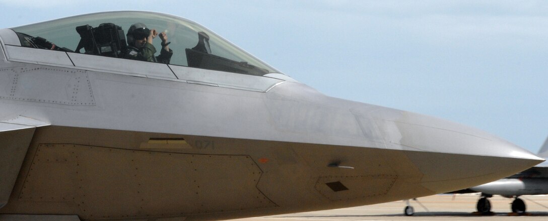 LANGLEY AIR FORCE BASE, Va. – An F-22A pilot from the 94th Fighter Squadron returns to Langley after training at Combat Archer Sept. 27.  Combat Archer, held at Tyndall Air Force Base, Fla.,  is an air-to-air weapons system evaluation program that allows pilots to test the reliability and effectiveness data of aircraft and missiles.  (U.S. Air Force photo/Airman 1st Class Zachary Wolf)