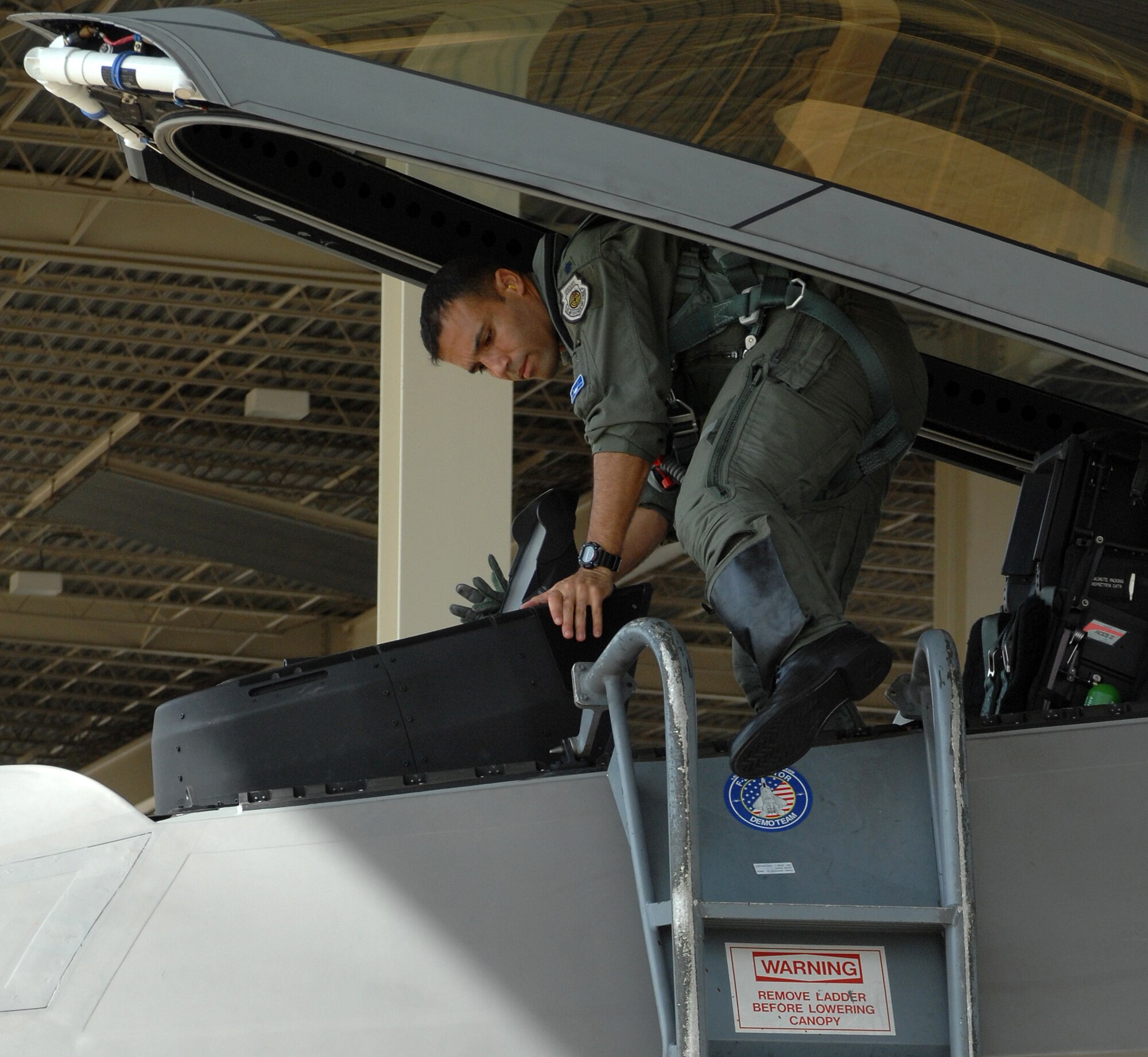 LANGLEY AIR FORCE BASE, Va. – Lt. Col. Adrian Spain, 94th Fighter Squadron operations officer, climbs out of his cockpit Sept. 27.  Colonel Spain was one of the pilots that participated in Combat Archer at Tyndall Air Force Base Fla.  Combat Archer is an air-to-air weapons system evaluation program that allows pilots to test the reliability and effectiveness data of aircraft and missiles.  (U.S. Air Force photo/Airman 1st Class Zachary Wolf)