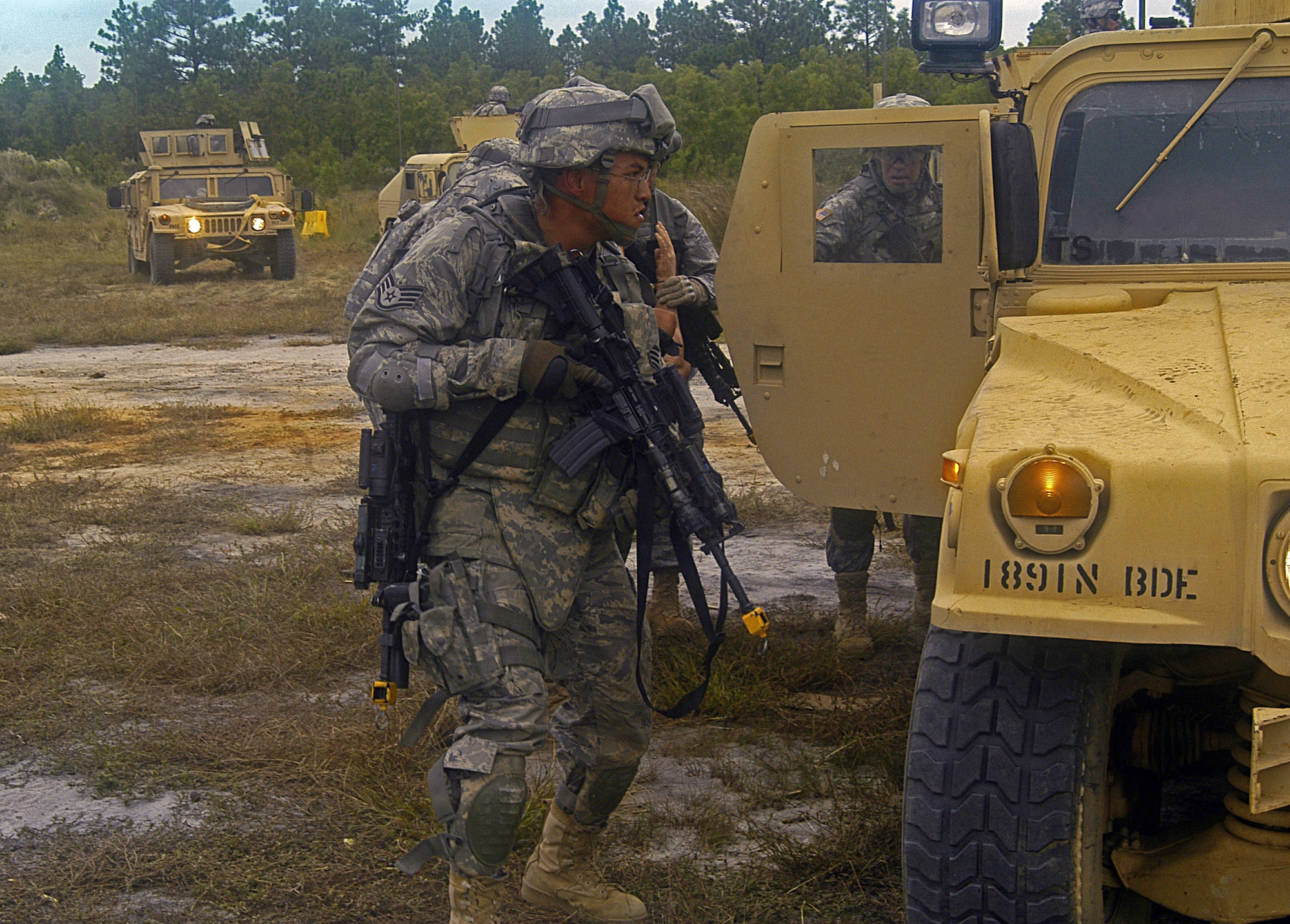 Airmen take cover during Combat Skills Training Sept. 23 at Fort Bragg, N.C. Airmen, Sailors and Soldiers are receiving combat training in anticipation of their deployment as members of 12 different Provincial Reconstruction Team members deploying to Afghanistan in November. The training includes convoy operations, weapons, counter improvised explosive device tactics, language and cultural training and combat lifesaving skills training. (U.S. Air Force  photo/Master Sgt. Eric M. Grill)