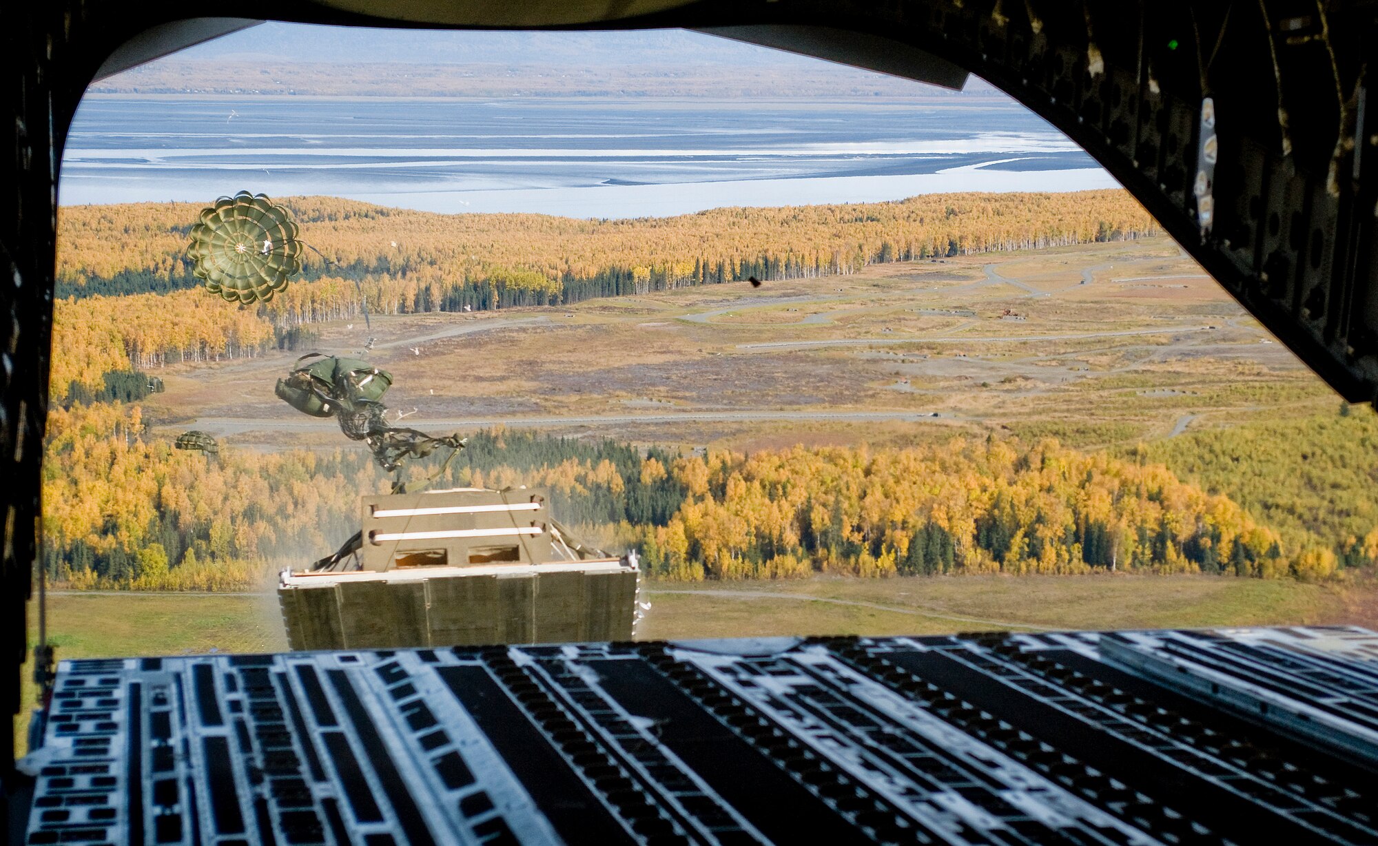 ELMENDORF AIR FORCE BASE, Alaska -- A pallet darts out of a 517th Airlift Squadron C-17 Globemaster III Sept. 26. The 517th AS trains daily for cargo and troops drops to prepare for real world contingencies. (U.S. Air Force photo/Senior Airman Jonathan Steffen)