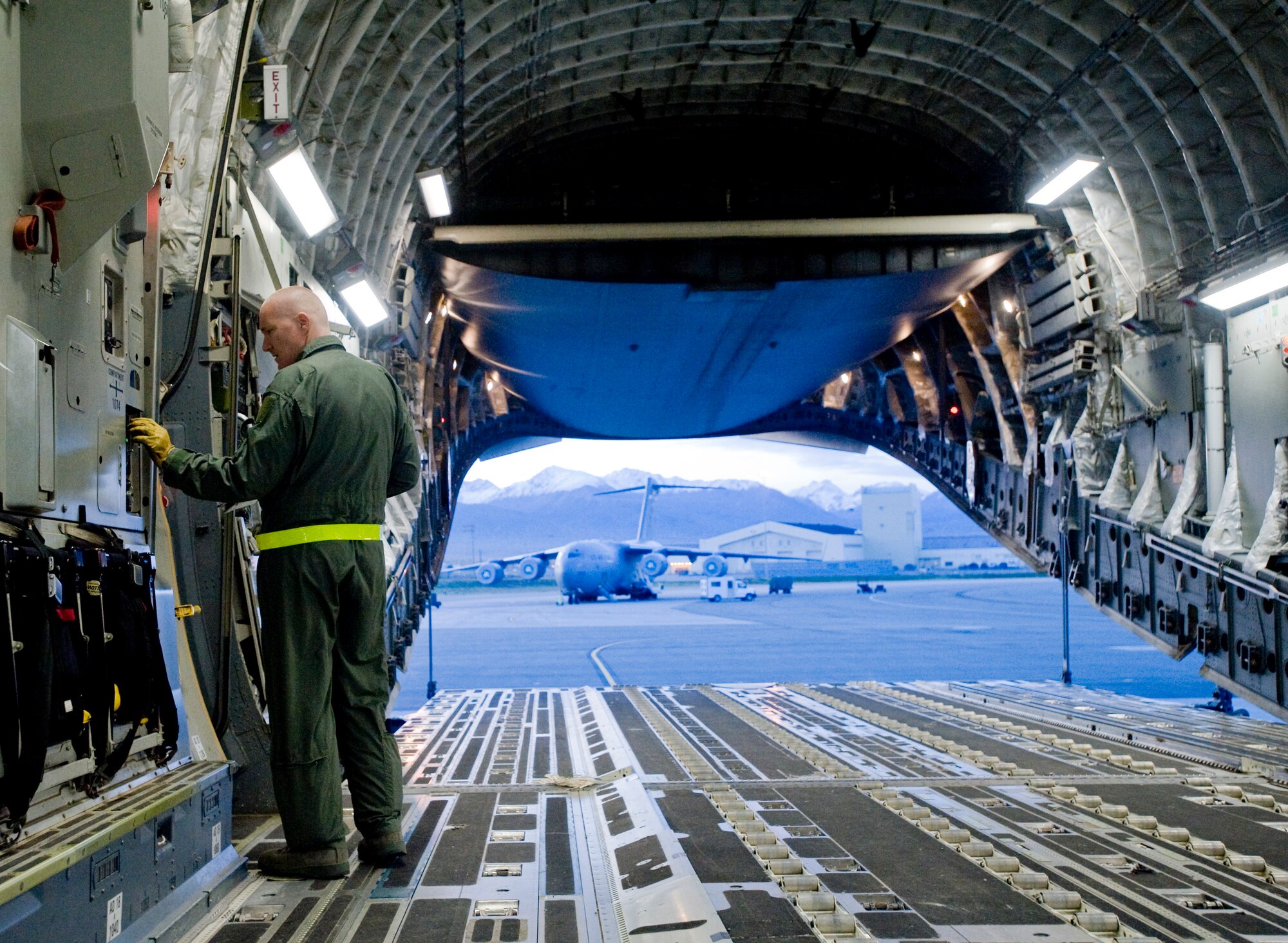 ELMENDORF AIR FORCE BASE, Alaska -- Staff Sgt. Terry Langston, a 517th Airlift Squadron loadmaster, sets the locks on the track system Sept. 26. The 517th AS trains daily for cargo and troops drops to prepare for real world contingencies. (U.S. Air Force photo/Senior Airman Jonathan Steffen)