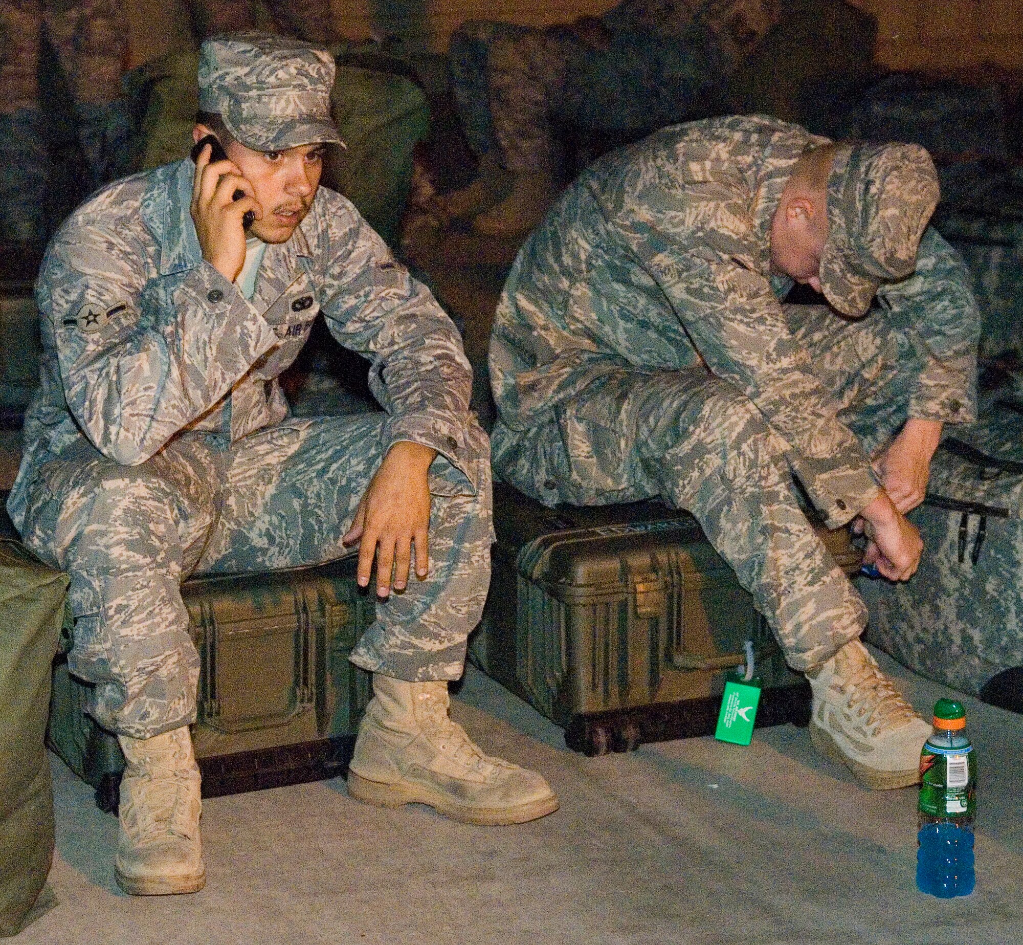 A departing Airman makes a final phone call prior to deployment. The 95th Security Forces Squadron deployed 28 servicemembers Sept. 23 for a six-month tour at Ali Air Base, Iraq, in support of Operation Iraqi Freedom. Before they left, they received a pre-departure briefing and were seen off by Col. Nancy Wharton, 95th Air Base Wing vice commander, and other base leadership. (U.S. Air Force photo Mike Cassidy)