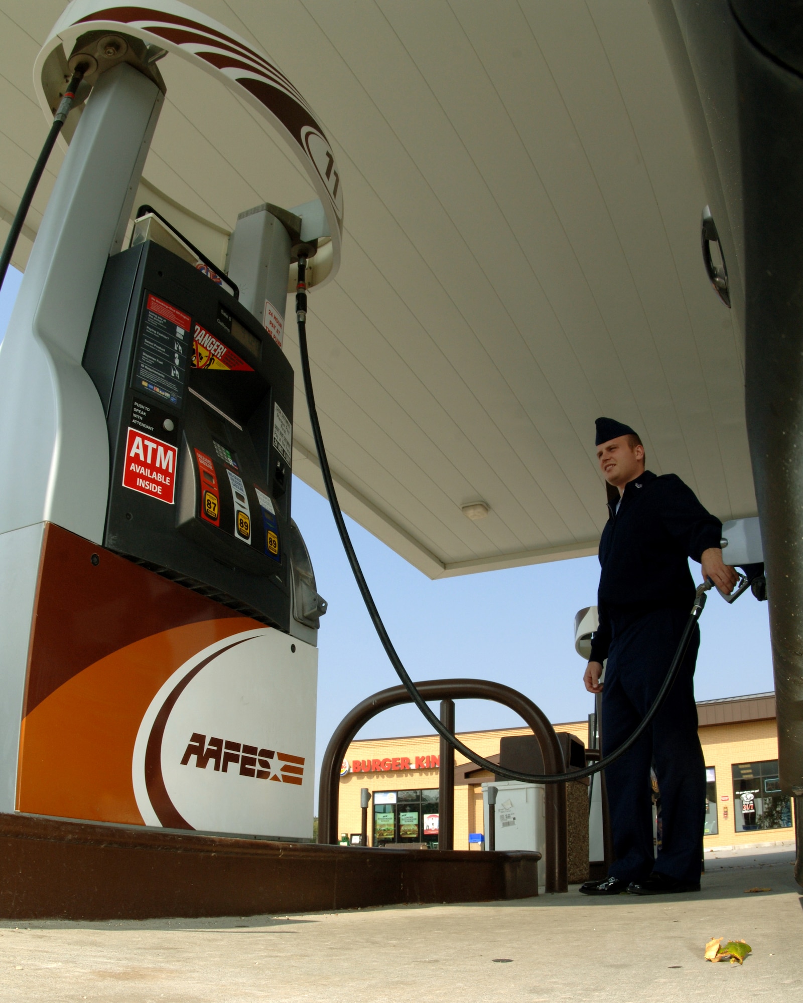 Staff Sgt. Matthew Simmons, 55th Communications Squadron, fills his gas tank at one of Offutt’s Army and Air Force Exchange Service stations Sept. 22.  Most people, including Sergeant Simmons, are feeling the financial pinch caused by higher gas prices. (U.S. Air Force Photo By Tech. Sgt. Rhonda Moraski)