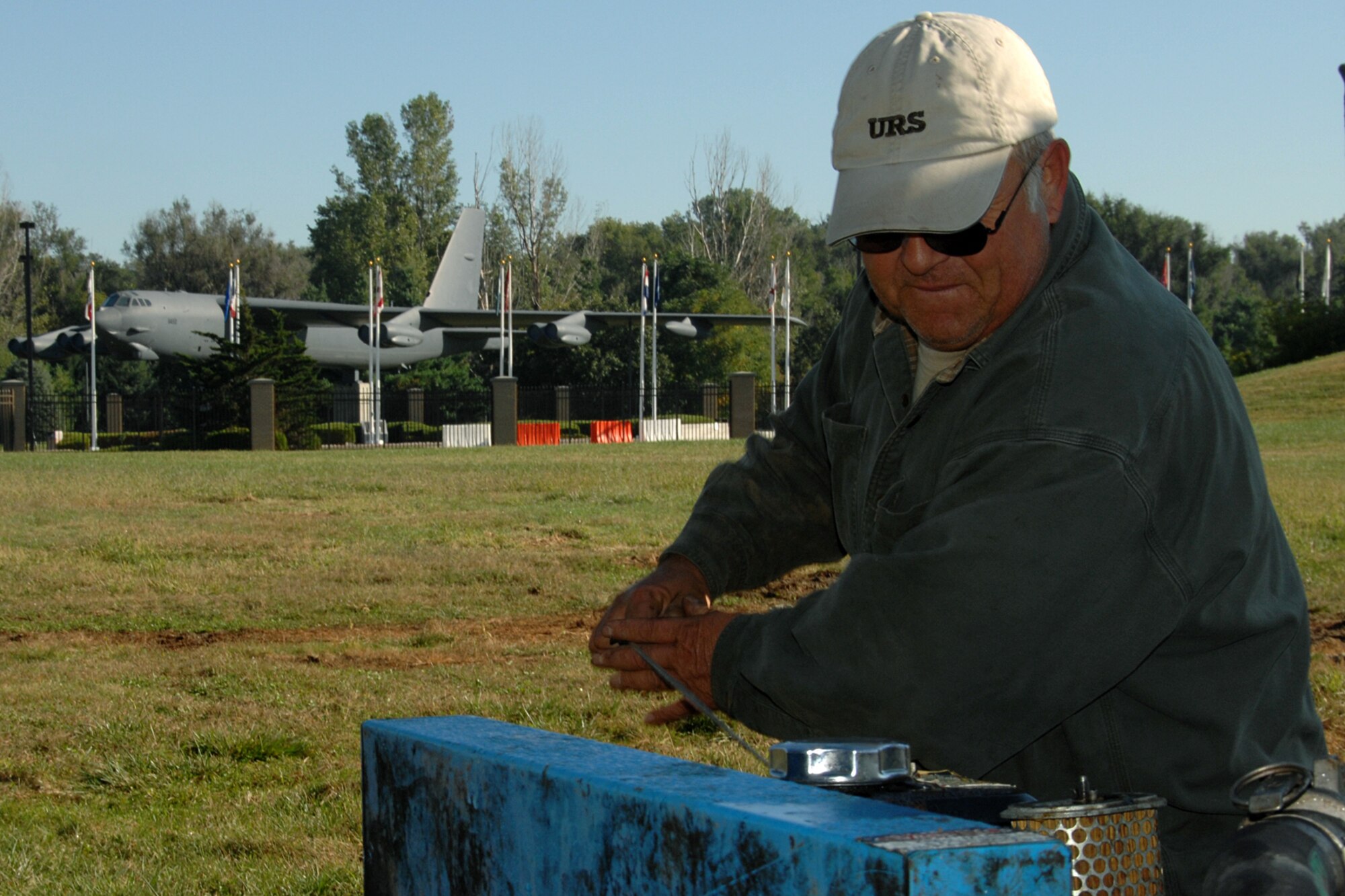 Mark Heinicke, a contractor with URS Corporation, starts the motor on a portable generator on Offutt Sept. 9.  The motor powers a bio-sparging system, part of a relatively new technology used as part of Offutt’s Environmental Restoration Program. Bio-sparging is the injection of a liquid mixture into groundwater plumes.  The liquid feeds microorganisms already present and ultimately results in the breakdown of contaminants in the plume. (U.S. Air Force Photo By Charles Haymond)