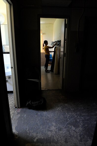 MOODY AIR FORCE BASE, Ga. -- Stacy Fischer, an actress for Deana's Educational Theater, prepares her costumes backstage before her performance during "The Yellow Dress" play here Sep. 26. The play is based on true accounts of sexual assault and abusive relationships. (U.S. Air Force photo by Senior Airman Brittany Barker)