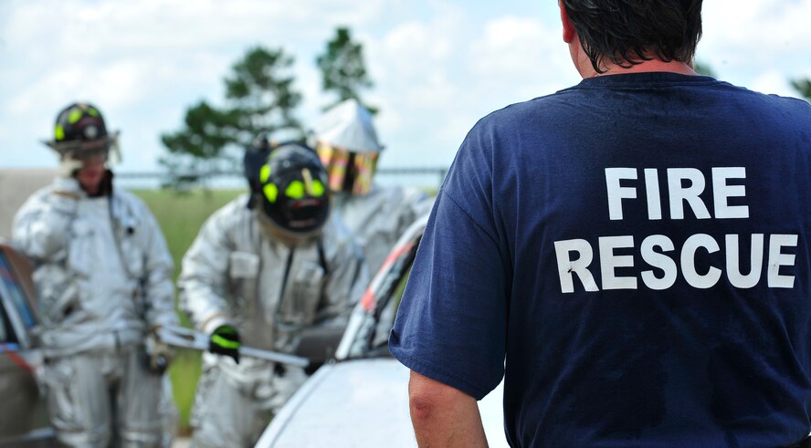 MOODY AIR FORCE BASE, Ga. -- Dana Mitchell, 23rd Civil Engineer Squadron driver operator, observes firefighters during extrication training here Sept. 11. During training and real world situations, the fire department always has a safety officer standing by to make sure no unsafe conditions or acts are performed. (U.S. Air Force photo by Senior Airman Elizabeth Rissmiller)
