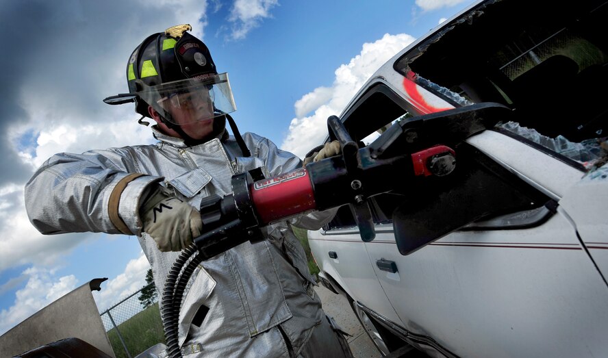 MOODY AIR FORCE BASE, Ga. -- Luke Wasick, 23rd Civil Engineer Squadron driver operator, uses the Jaws of Life during extrication training here Sept. 11. The Jaws of Life are used to spread, pull, or lift any part of the vehicle necessary to safely remove the victim. (U.S. Air Force photo by Senior Airman Elizabeth Rissmiller)