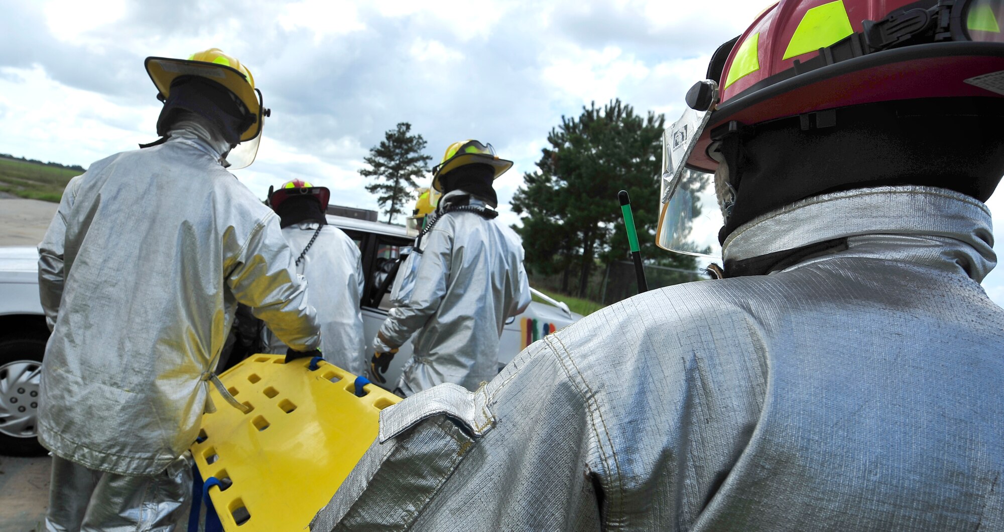 MOODY AIR FORCE BASE, Ga. -- 23rd Civil Engineer Squadron firefighters position a back board during training here Sept. 11. Firemen use the fiberglass backboard to stabilize the victim prior to moving them. (U.S. Air Force photo by Senior Airman Elizabeth Rissmiller)