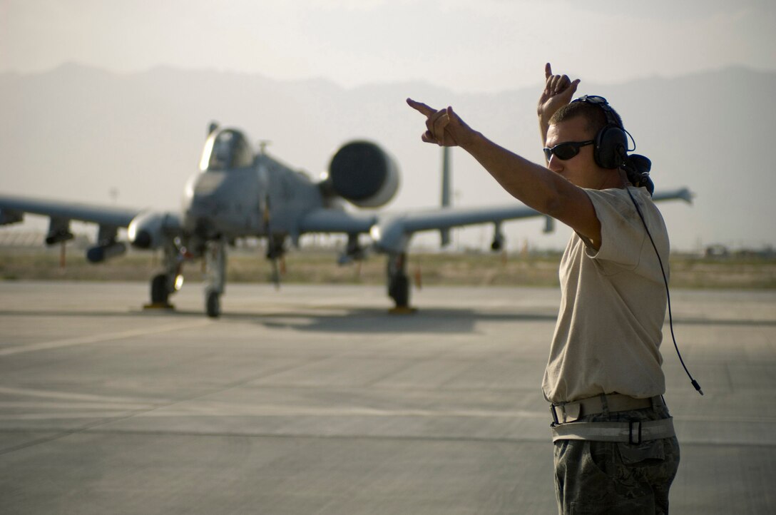 Staff Sgt. Kevin Bliem marshals an A-10 Thunderbolt II Sept. 12 at Bagram Airfield, Afghanistan. Sergeant Riem is a crew chief with the 455th Expeditionary Aircraft Maintenance Squadron. (U.S. Air Force photo/Staff Sgt. Rachel Martinez)
