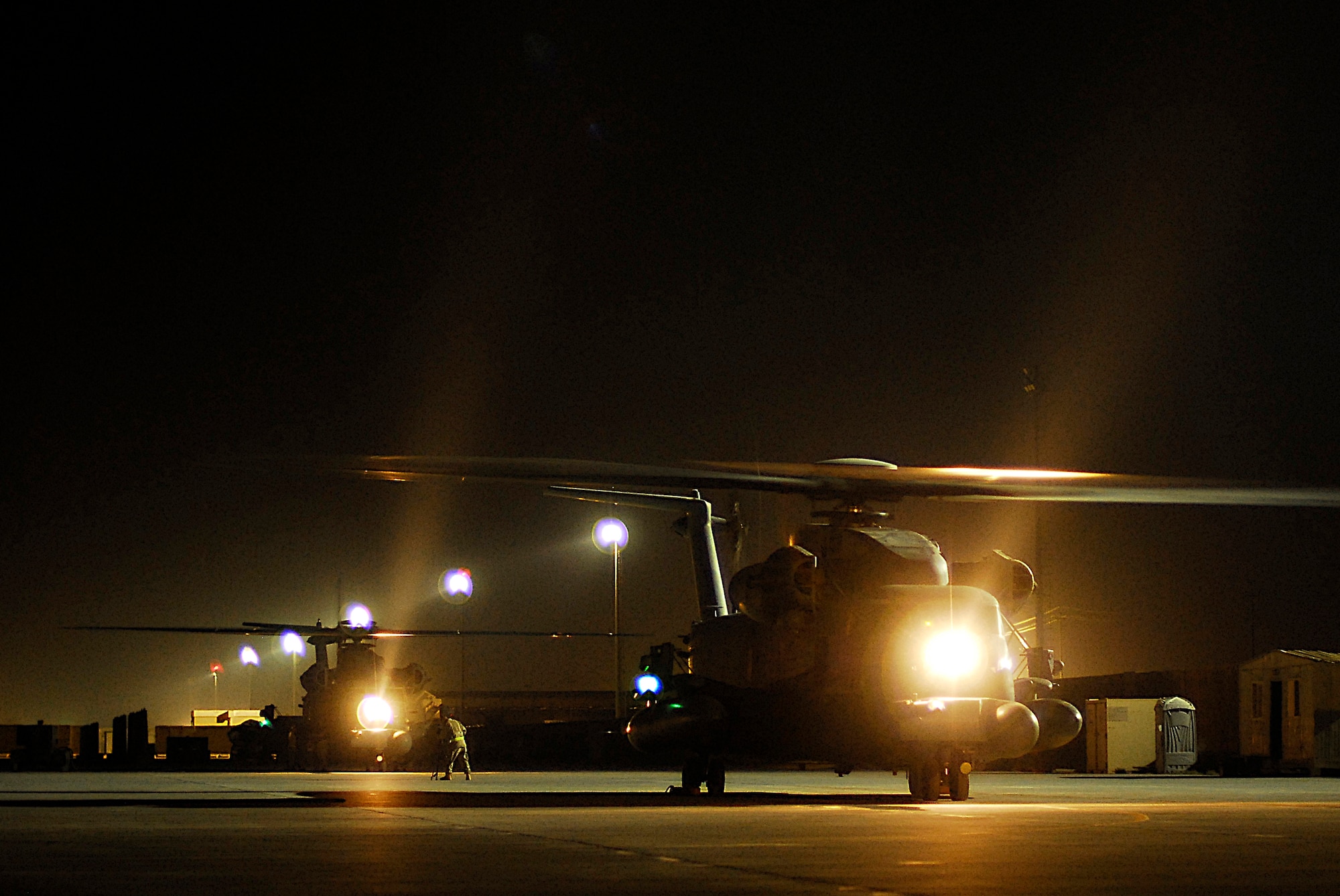 Two MH-53 Pave Low Helicopters prepare for takeoff in their last combat mission Sept. 27. The Pave Lows' last mission was to supply special operations forces in support of Operation Iraqi Freedom. The MH-53 is scheduled to be retired from the Air Force inventory Sept. 30. The primary function of the aircraft was long-range infiltration, exfiltration and resupply of special operations forces day or night and in adverse weather conditions. It was the largest, most powerful and technologically advanced helicopter in the Air Force, with a service record dating back to the Vietnam War. (U.S. Air Force photo/Airman 1st Class Jason Epley)