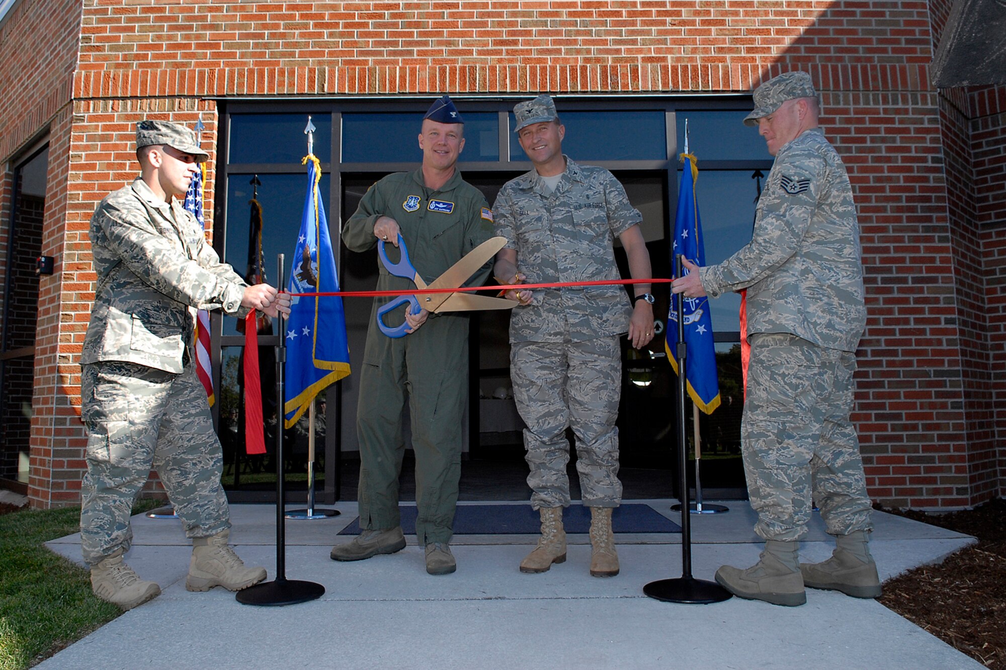 On September 16, 2008 at 9 a.m. the 21st Medical Group conducted a ribbon cutting Ceremony to celebrate the opening of the Peterson AFB Clinic’s new parking lot and renovated front entrance. The new front entrance and parking lot represent the completion of the sixth phase in a 12-phase, $10 million renovation project for Bldg 959. The project began in November 2007 and is projected to be complete around April 2009. Each phase of this project allows the 21st MDG to improve upon its services for all beneficiaries. The new front entrance and new parking lot brings the 21st MDG closer to meeting the requirements necessary for today's standard of care as well as making the building safer for patients and staff members alike. 

Key Facts: 1. $10M 12 Phase Project 2. Construction began in November 2007 3. Front Entrance/Parking Lot now meet ATFP requirements 4. 21st MDG has about 25K beneficiaries 