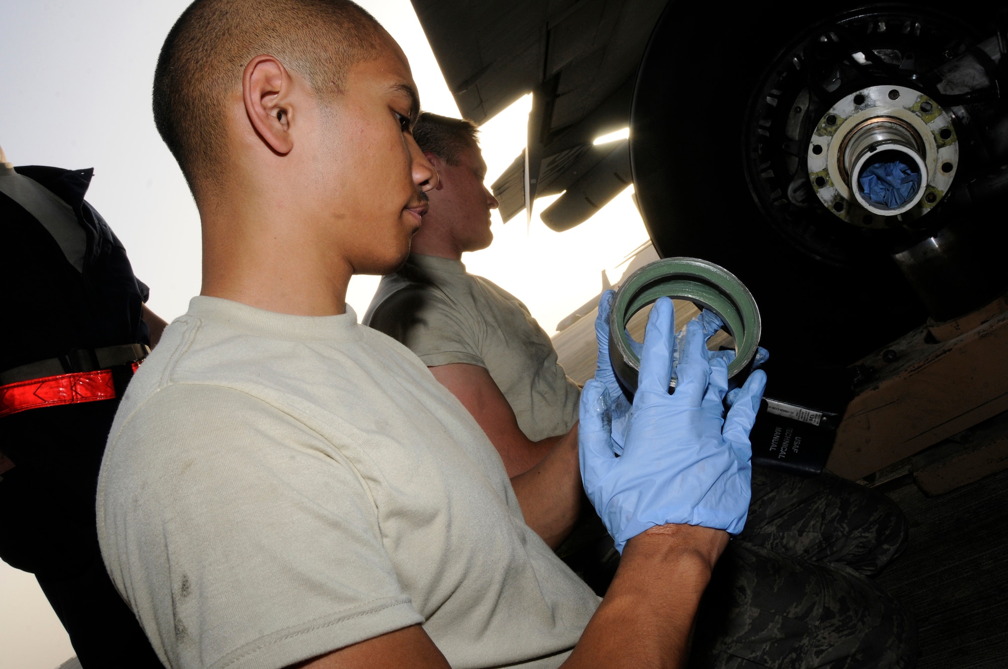 Airman 1st Class James Giesick, 379th Expeditionary Aircraft Maintenance Squadron, 340th Aircraft Maintenance Unit, lubricates a wheel spacer prior to installing a new brake set on a KC-135 aircraft Sept. 28, 2008, at an undisclosed air base in Southwest Asia.  The brake set had to be replaced when a crack in the heat shield was detected during a post-flight inspection.  Airman Giesick, a native of San Diego, Calif., is deployed from Grand Forks Air Force Base, N.D., in support of Operations Iraqi and Enduring Freedom and Joint Task Force-Horn of Africa.  (U.S. Air Force photo by Tech. Sgt. Michael Boquette/Released)