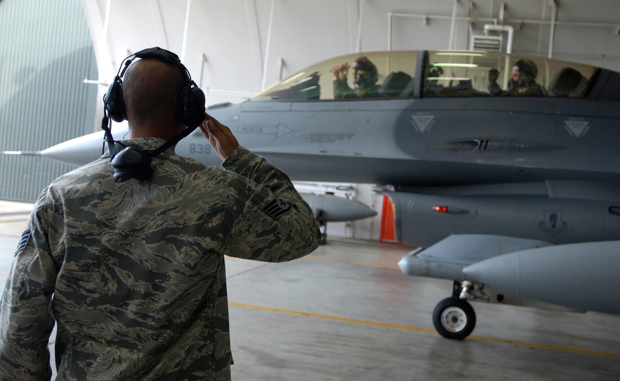 MISAWA AIR BASE, Japan -- Capt. Patrick McGarry, 13th Fighter Squadron, taxis out of the hardened aircraft shelter with Gen. Carrol H. "Howie" Chandler, Pacific Air Forces commander, as his passenger Sept. 26, 2008. While here, General Chandler took the opportunity to meet with members of the 13th Fighter Squadron who are training for an upcoming deployment. (U.S. Air Force photo by Senior Airman Chad Strohmeyer)