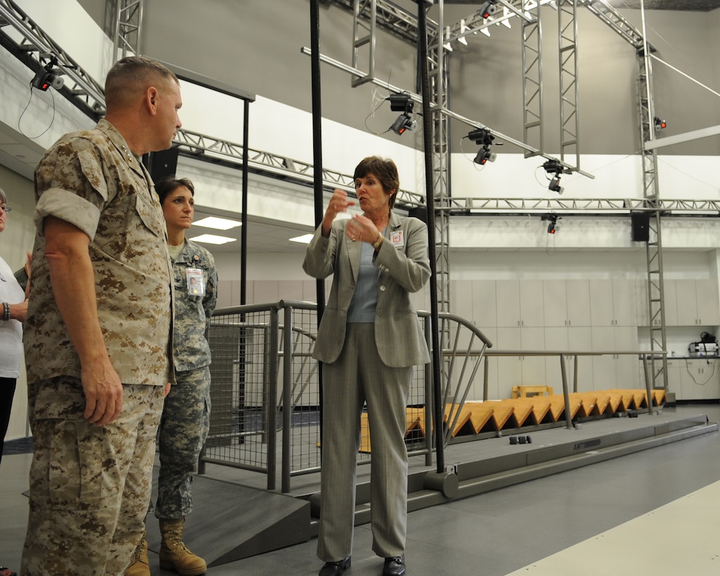 Vice Chairman of the Joint Chiefs of Staff U.S. Marine Gen. James E. Cartwright gets a simulator briefing from Dr. Rebecca Hooper during a visit to the Center for the Intrepid at Brooke Army Medical Center in San Antonio, Texas, Sept. 26, 2008. Cartwright toured the facility with professional wrestler Mick Foley to visit wounded warriors and learn about their health care.