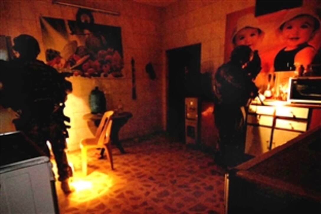 U.S. Army soldiers search a house in Risalah, Baghdad, Iraq Sept. 26, 2008. The soldiers are assigned to the 3rd Infantry Division's Company B, 4th Batallion, 64th Armor Regiment.