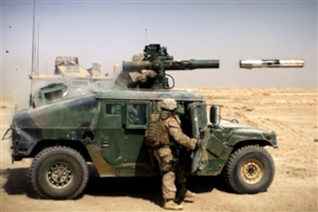 U.S. Marine Corps Lance Cpl. Jeffery Evans fires a tube-launched, optically tracked wire-guided missile from a turret during an exercise in Fallujah, Iraq, Sept. 21, 2008. Evans is a gunner assigned to Weapons Company, 3rd Battalion, 6th Marine Regiment.
