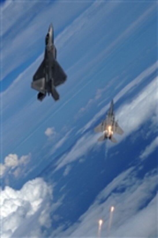 A U.S. Air Force F-22 Raptor aircraft (left) and an F-15 Strike Eagle from the 325th Fighter Wing participate in air-to-air maneuvers over eastern Florida on Sept. 22, 2008.  
