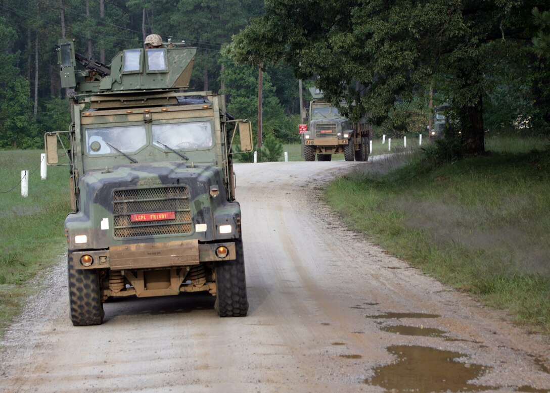 Marines from Combat Logistics Battalion 22, 22nd Marine Expeditionary Unit, roll through a live-fire convoy training range Sept. 29, 2008, aboard Fort Pickett, Va., a Virginia Army National Guard Maneuver Training Center. The Marines of CLB 22 are conducting off-site training, the first major exercise of a six-month pre-deployment training cycle for the 22nd MEU. (Official Marine Corps photo by Cpl. Theodore W. Ritchie)::r::::n::
