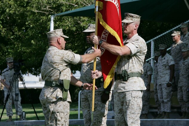 7th Marines Regimental Sgt. Maj. Michael Kufchak, receives the regimental colors from Col. Randall P. Newman after Newman assumed command of the regiment during a change-of-command ceremony at the Combat Center’s Torrey L. Gray Field Sept. 30. Hubbard, a native of Lynchburg, Va., assumed command in June, and will continue to serve the regiment as their executive officer. Newman, a native of Economy, Ind., comes to the regiment from the Office of the Secretary of Defense where he served as a military assistant for the executive secretary of the Department of Defense.