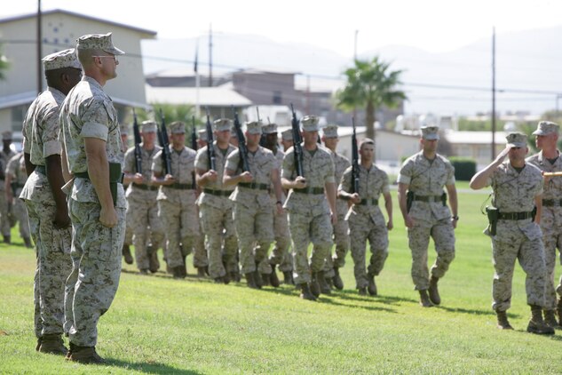 Col. Randall P. Newman, commanding officer of 7th Marine Regiment, stands at attention next to Lt. Col. Michael P. Hubbard, 7th Marines’ executive officer, during a pass and review of the regiment after assuming the duty of regimental commander at a change-of-command ceremony at the Combat Center’s Torrey L. Gray Field Sept. 30. Col. Newman’s personal decorations include the Bronze Star Medal and the Navy Marine Corps Commendation Medal, both with Combat “V” and gold star in lieu of second award, and Combat Action Ribbon. He is married to the former Hillary Dandrow of West Lafayette, Ind., and together they have one son, Vincent.
