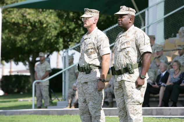 Col. Randall P. Newman, commanding officer of 7th Marine Regiment, stands at attention next to Lt. Col. Michael P. Hubbard, 7th Marines’ executive officer, after assuming command of the regiment at a change-of-command ceremony at the Combat Center’s Torrey L. Gray Field Sept. 30. Col. Newman’s personal decorations include the Bronze Star Medal and the Navy Marine Corps Commendation Medal, both with Combat “V” and gold star in lieu of second award, and Combat Action Ribbon. He is married to the former Hillary Dandrow of West Lafayette, Ind., and together they have one son, Vincent.