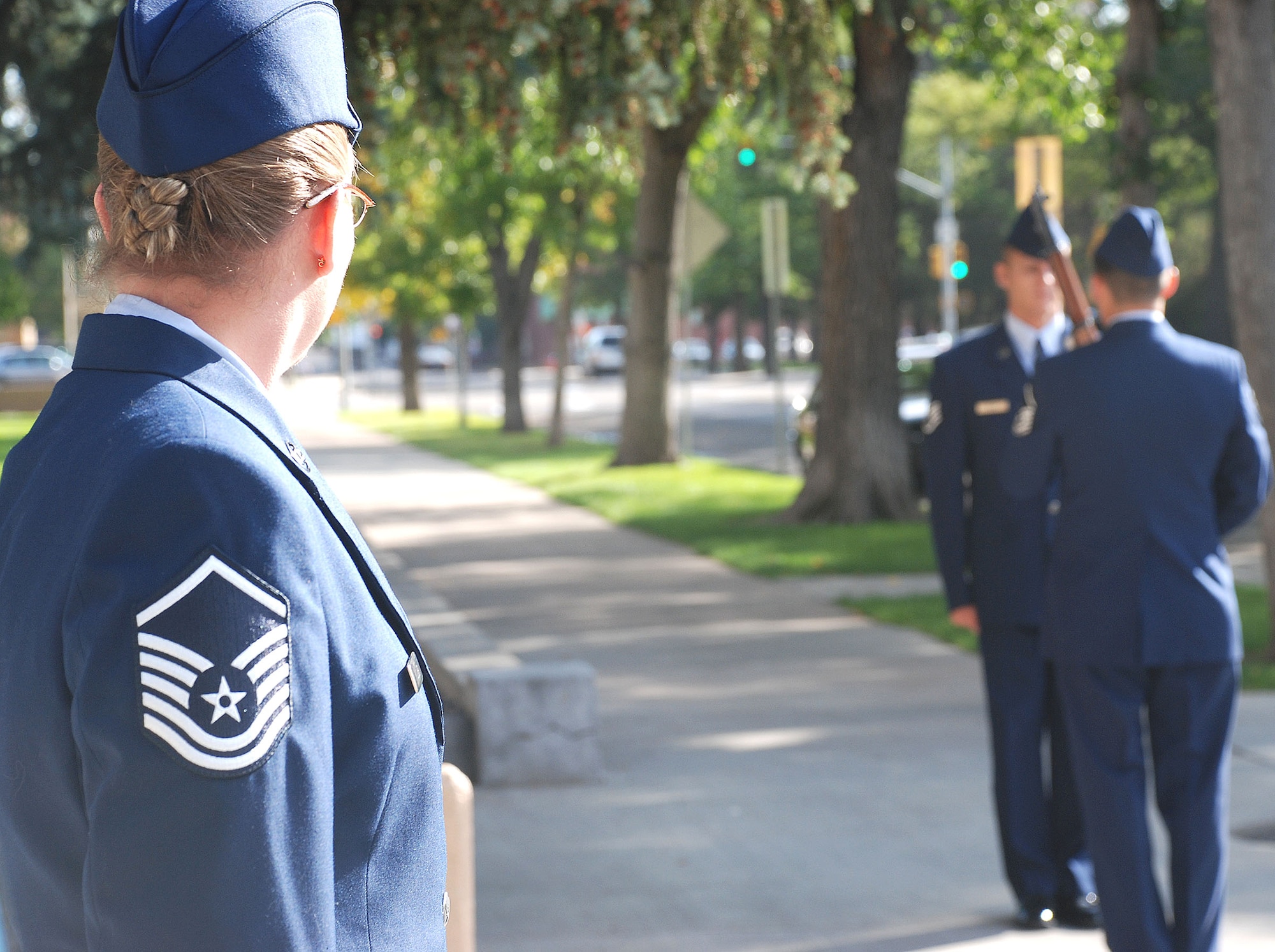 Master Sgt. Scott Archer and Staff Sgt. Dane Sauer, 90th Medical Operations Squadron, perform a sentry post change as Master. Sgt. Jeanette Olive, 90th MDOS, looks on during a POW/MIA vigil at the Wyoming State Capitol Building Sept. 19. For 24 hours, two Airmen at a time marched as sentries as another Airman read names of past service members who are presumed to still be prisoners of war, and are still missing in action. 