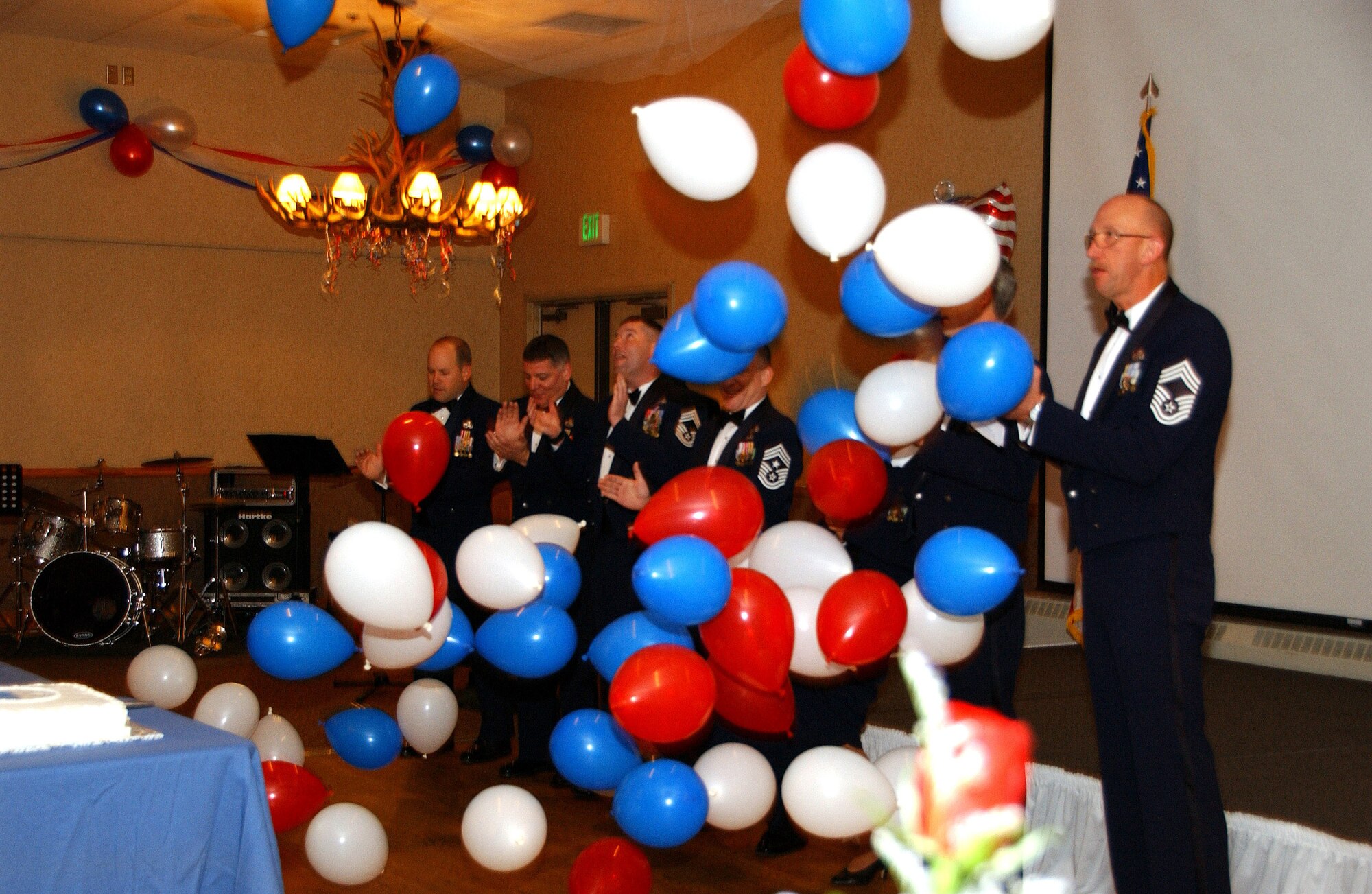 Chief Master Sergeants lead in singing the Air Force song at the 2008 Air Force Gala at Eielson Air Force Base, Alaska, Sept. 26, 2008. This event is a celebration of the 61st Air Force birthday. (U.S. Air Force photo by Airman Laura Max)                               