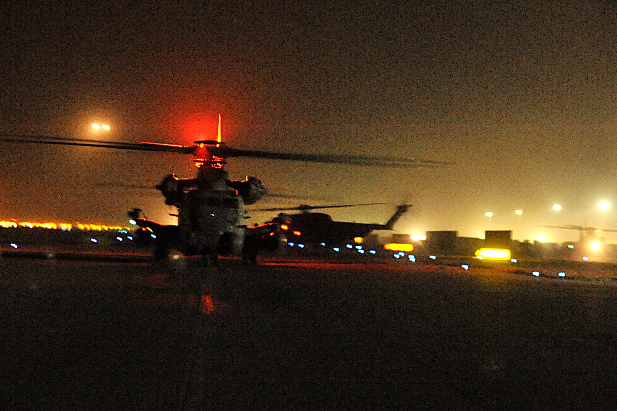 U.S. Air Force MH-53 Pave Low's from the 20th Expeditionary Special Operations taxi onto to a runway in Iraq prior to the last combat mission of the Pave Low helicopter Sept. 27. The MH-53 Pave Low is being retired after nearly 40 years of service to the United States Air Force. (Photo by Staff Sgt. Aaron Allmon)  
