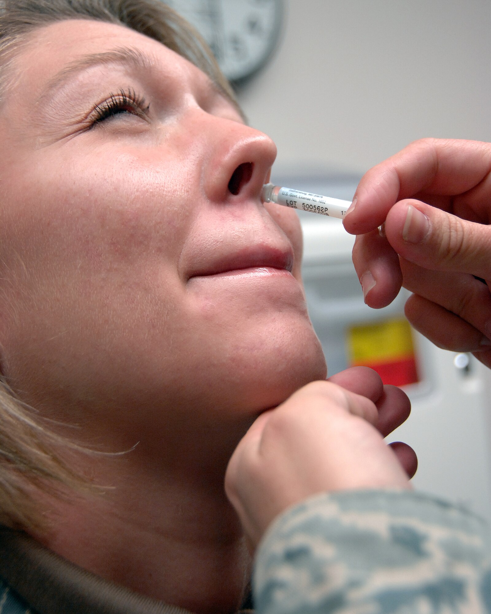 Airman Laura Max, 354th Fighter Wing Public Affairs, gets her flu mist Sept. 30 at the 354th Medical Group vaccination center. The influenza mist is a painless alternative to the more commonly known injection. (U.S. Air Force photo taken by Airman 1st Class Willard E. Grande II)