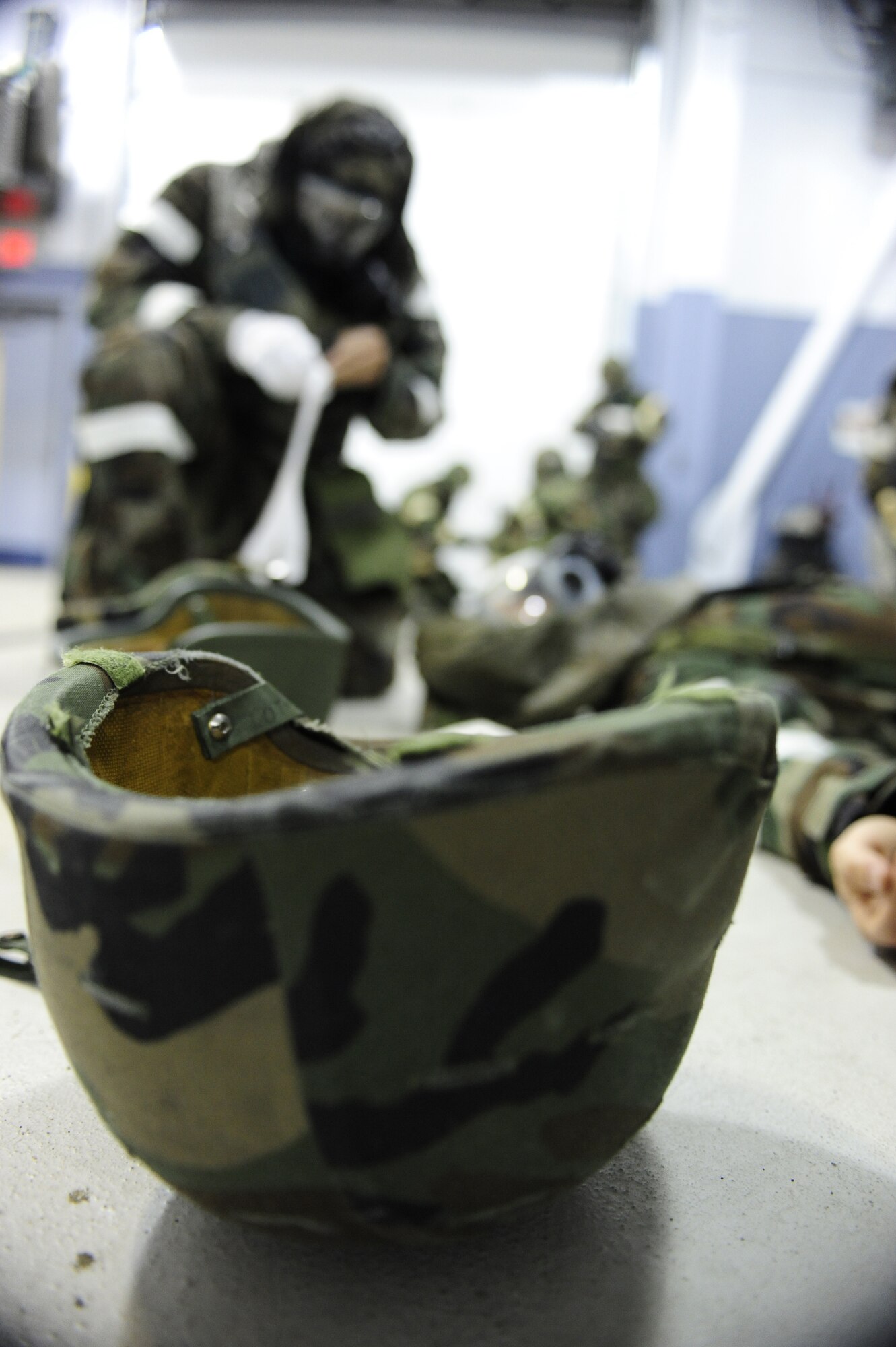 Capt. Chris Lehto, 18th Aggressor Squadron pilot, performs self-aid buddy care on 1st Lt. Geoffrey Slater, 354th Operations Support Squadron, while they are being scored on speed and accuracy during a wing readiness day competition Sept. 26, 2008, at Eielson Air Force Base, Alaska. The competition consisted of several four man teams which represented each squadron on base. The station’s setup involved basic elements of deployment training.  (U.S. Air Force photo/Airman 1st Class Jonathan Snyder)