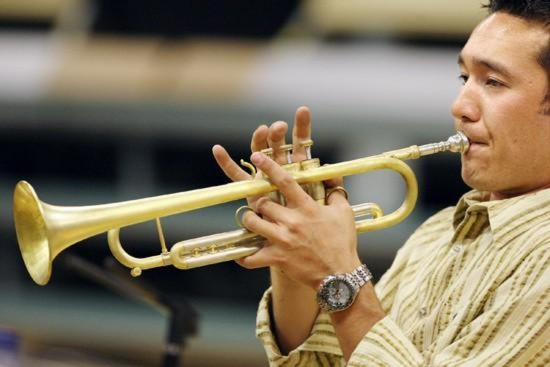 Billings native Patrick Brush warms up on his trumpet Friday before playing a concert with the U.S. Air Force Heartland of America Band at the Lincoln Center.