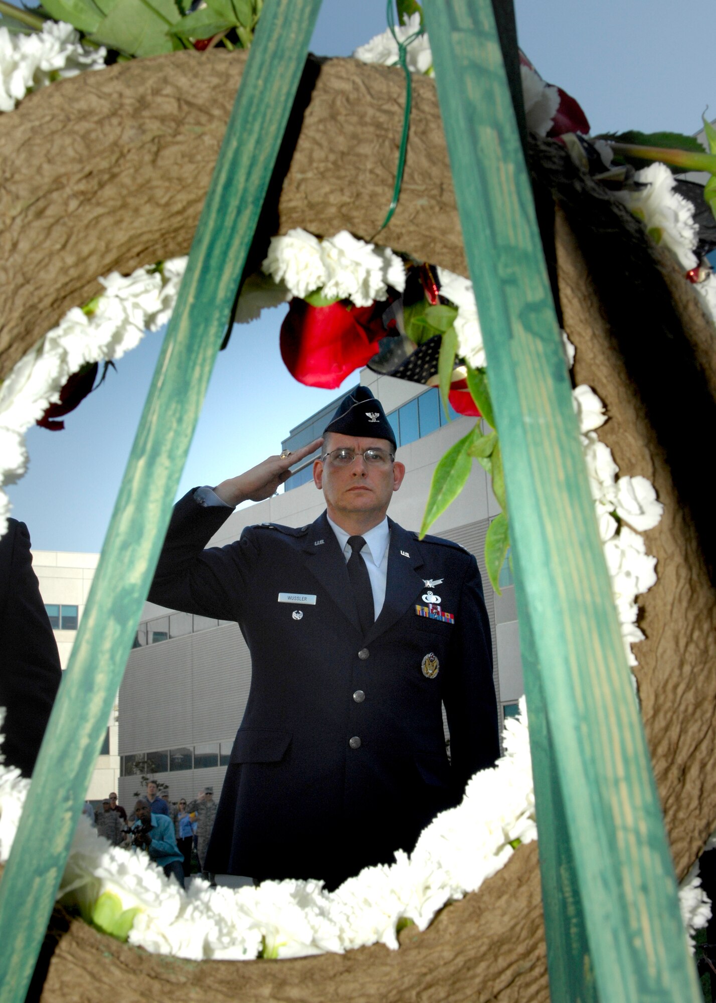 Col. Donald Wussler, Jr., Space and Missile Systems Center Global Positioning Systems Wing, renders a salute to the wreath during the POW/MIA Wreath Laying Ceremony at the Schiever Space Complex courtyard, Sep. 19. The ceremony was preceded by a 24-hour torch relay commemorating the National POW/MIA Recognition Day, which more than 180 military, civilian, contractor, and family members from Los Angeles Air Force Base participated. (Photo by Stephen Schester) 