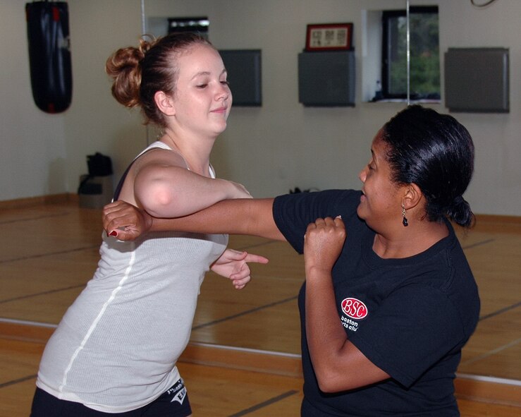 HANSCOM AFB, Mass. – Chelsea Graybear (left) and Adriana Swann (right) practice some of the defensive techniques taught during the Women’s Self Defense class at the Fitness Center on Sept. 27. For more information on upcoming classes at the Sports and Fitness Center go to www.hanscomservices.com. (U.S. Air Force photo by Dennis Lewis)