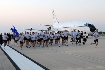 Airmen from the 12th Flying Training Wing run down the flightline Sept. 26 during "A Call to Arms," a day-long event that helped build esprit de corps among servicemembers with the day's activities -- the flightline run, a breakfast and commander's calls. (U.S. Air Force photo by Rich McFadden)