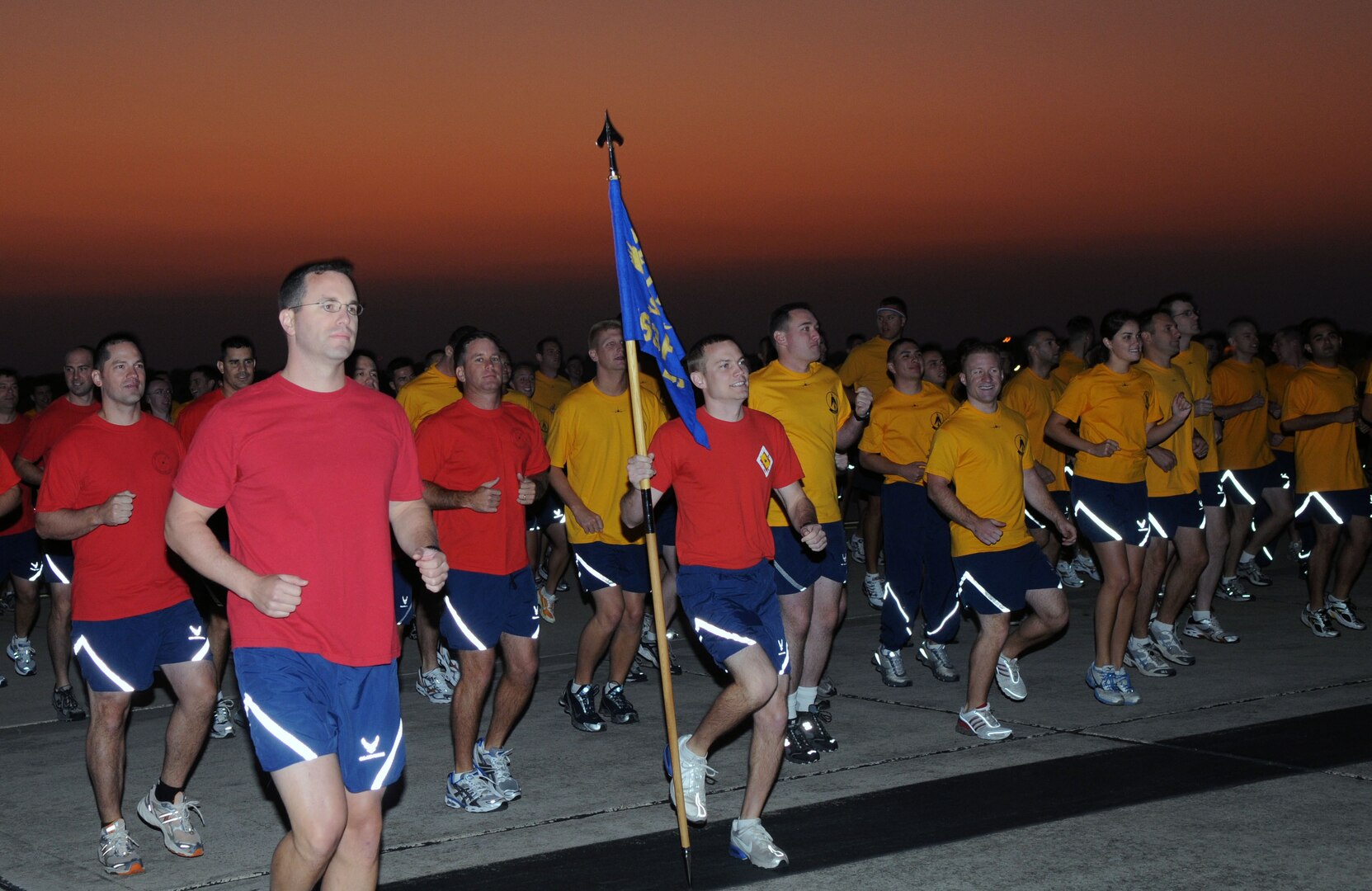 Airmen from the 12th Flying Training Wing warm up for a run Sept. 26 during "A Call to Arms," a day-long event that helped build esprit de corps among servicemembers with the day's activities -- the flightline run, a breakfast and commander's calls. (U.S. Air Force photo by Joel Martinez)