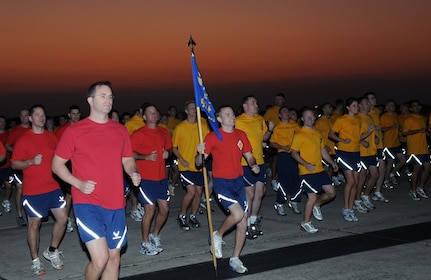 Airmen from the 12th Flying Training Wing warm up for a run Sept. 26 during "A Call to Arms," a day-long event that helped build esprit de corps among servicemembers with the day's activities -- the flightline run, a breakfast and commander's calls. (U.S. Air Force photo by Joel Martinez)