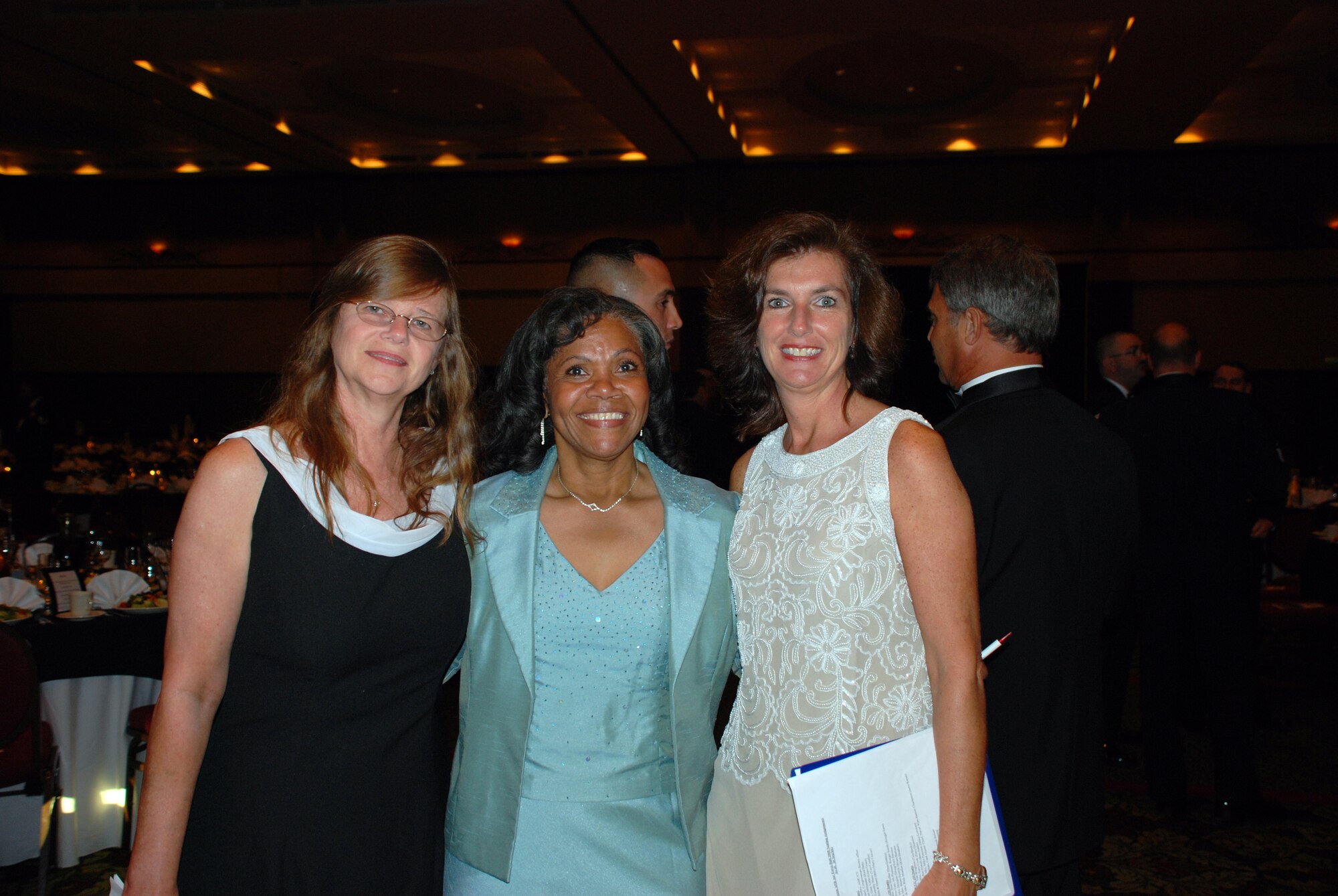 Debbie Baldwin, Rose Alexander and Kathy Knichel - who were all organizers for this years Air Force Ball - pose for a photo.  The Air Force Ball was postponed for three weeks due to evacuations forced by Hurricane Hannah. (U.S. Air Force photo/Mr. Robert Baldwin) 