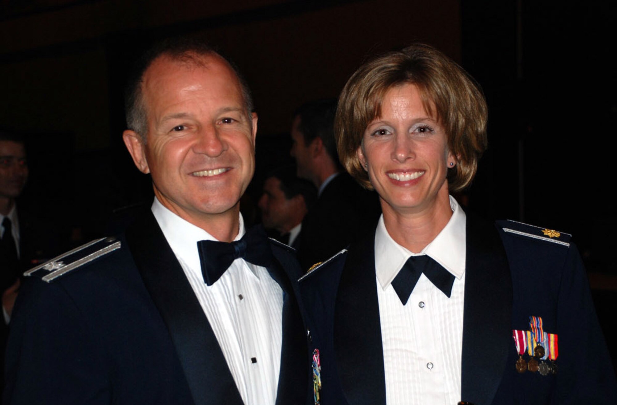 Lt. Col. Russ Catanach and Major Jennifer Mitchell pose for a picture at the 2008 Air Force Ball.  The Air Force Ball was postponed for three weeks due to evacuations forced by Hurricane Hannah. (U.S. Air Force photo/Mr. Robert Baldwin) 
